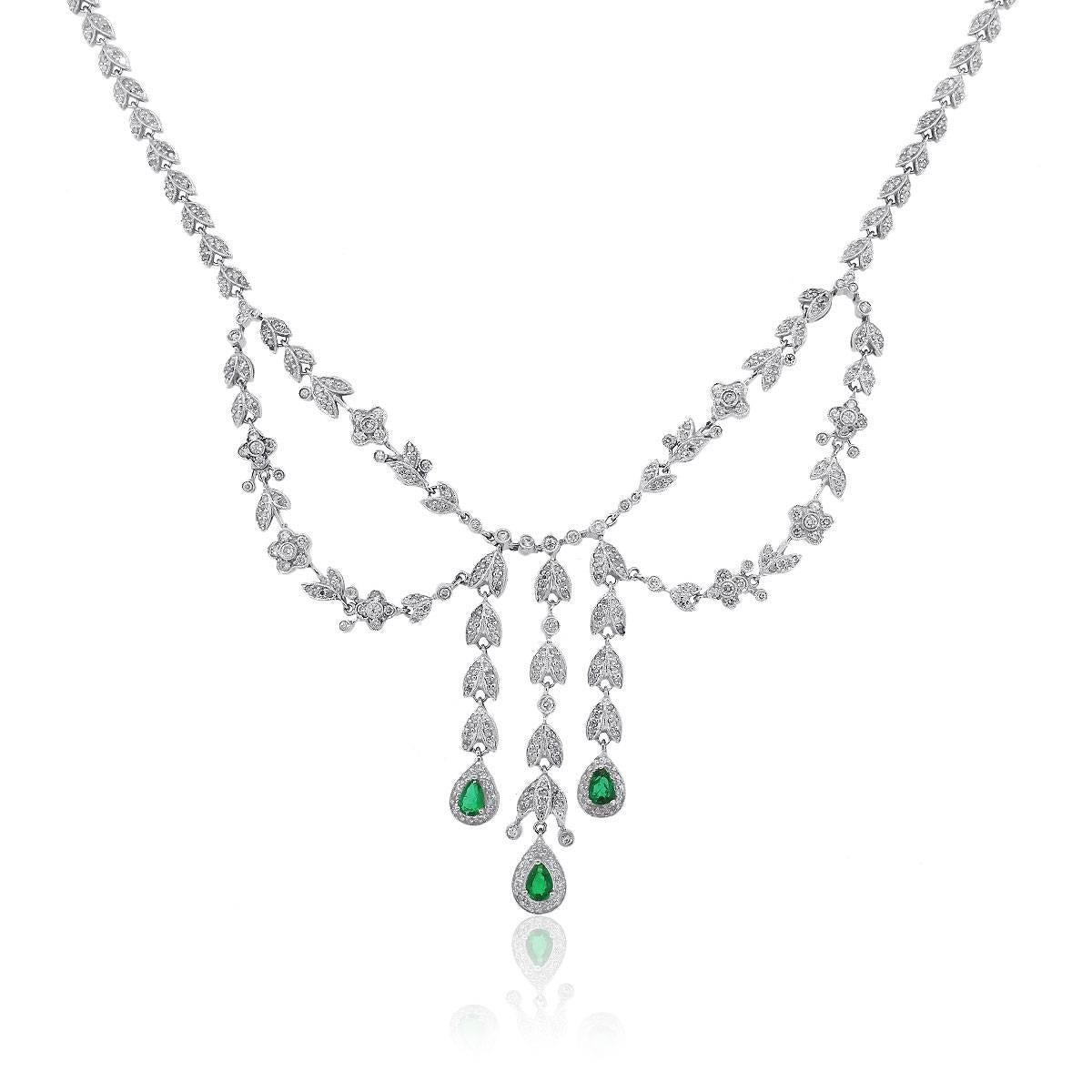 Style: Pear Shape Emerald Dangling Necklace
Metal: 14k White Gold 
Diamond Details: Approximately 1.50ctw Round cut diamond. Diamonds are H/I in color and SI in clarity
Gemstone Details: Approximately 1.2ctw of Pear shape Emeralds.
Total Weight: 30g