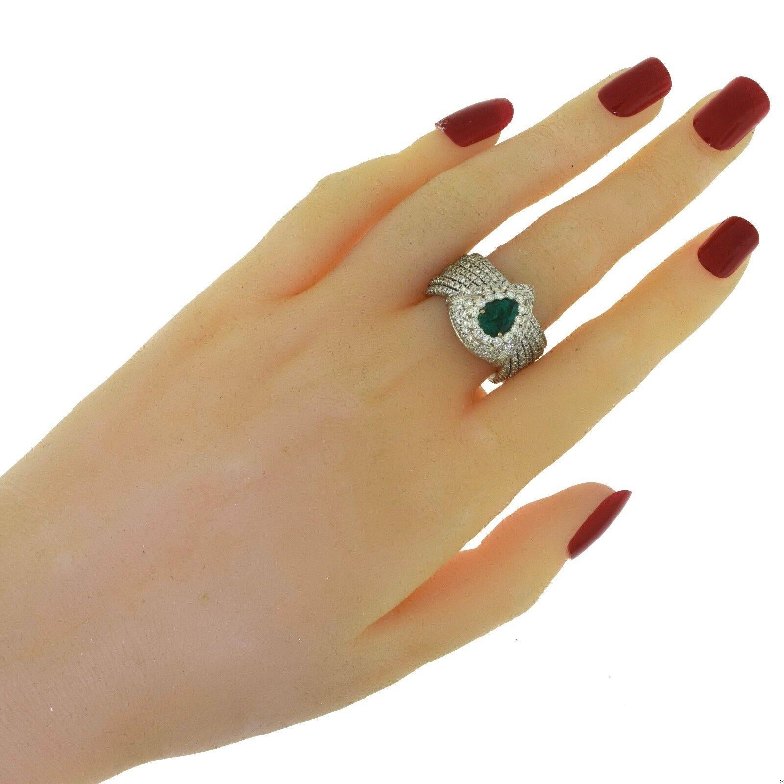 Stone: Diamonds & Emeralds
Carat Weight: 9.0 ct (3.5ct Emerald + 5.5ct Diamonds) 
Diamond Clarity: VVS
Diamond Color: F
Size: 7.75 – 8 (sizable)
Band Width: 11.95 mm tapers to 5.09 mm
Total Item Weight (grams): 18.4
