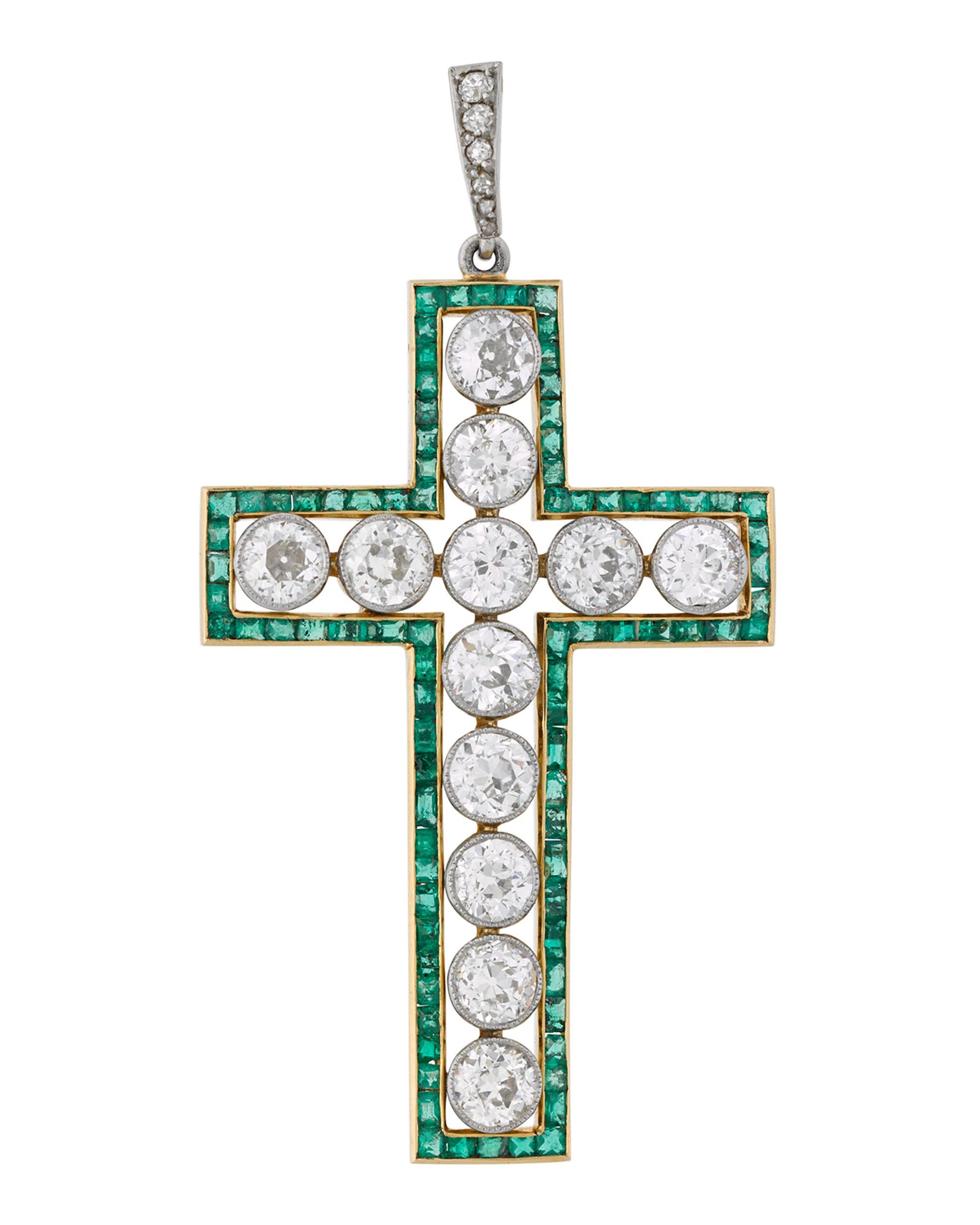 The twelve brilliant-cut round white diamonds in this incredible antique cross pendant weigh approximately 3.00 carats. Outlining these glistening jewels are beautiful emeralds that imbue this piece with a wonderful, vibrant green color. Set in 18K