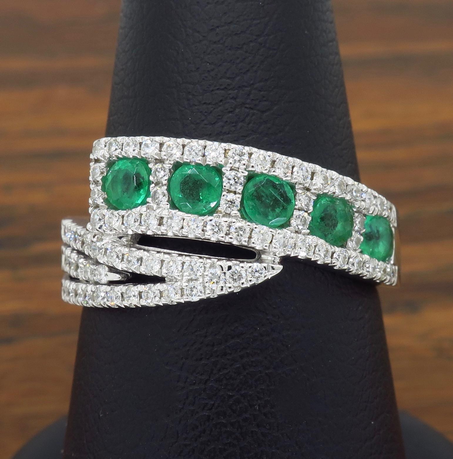 This unique emerald and diamond bypass style ring features .56CTW of Emeralds and .48CTW of Round Brilliant Cut Diamonds

 
Gemstone: Emerald & Diamonds
Gemstone Carat Weight: .56CTW Round Cut Emeralds
Diamond Carat Weight: Approximately .48CTW