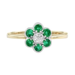 Blumenförmiger Ring mit Diamanten und Smaragden aus 14K Gelbgold