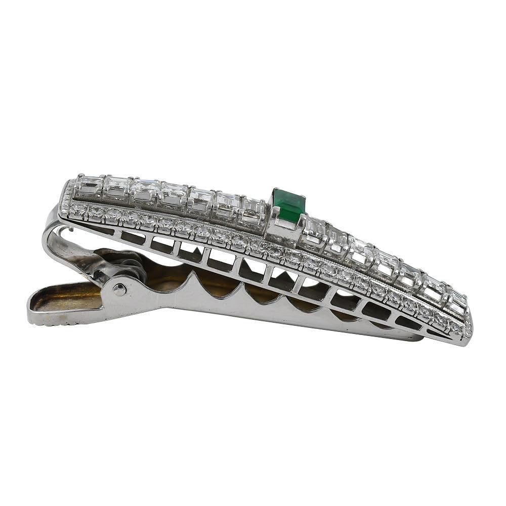 Hark back to the days of the Great Gatsby with this luxurious hair pin. Set with approximately 5 Carats of white colorless diamonds and a gem quality green emerald which relive the roaring 20's.