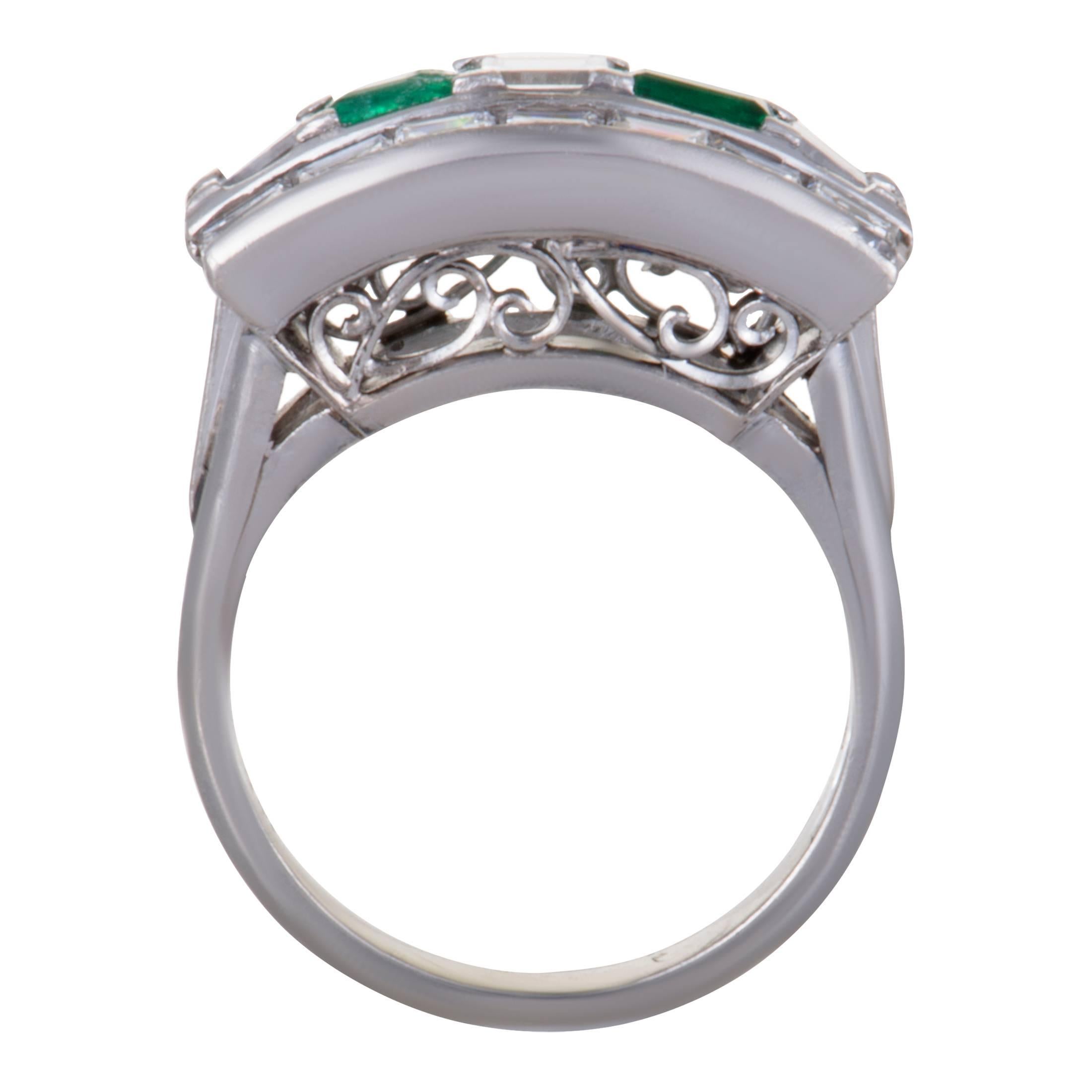 This classy platinum ring features a chic and elegant style. It's gorgeous design is embellished with 1.91ct of precious diamonds and stunning green emeralds of 0.41ct that adds glamour to the magnificent ring.
Ring Size: 6.25
Ring Top Dimensions: