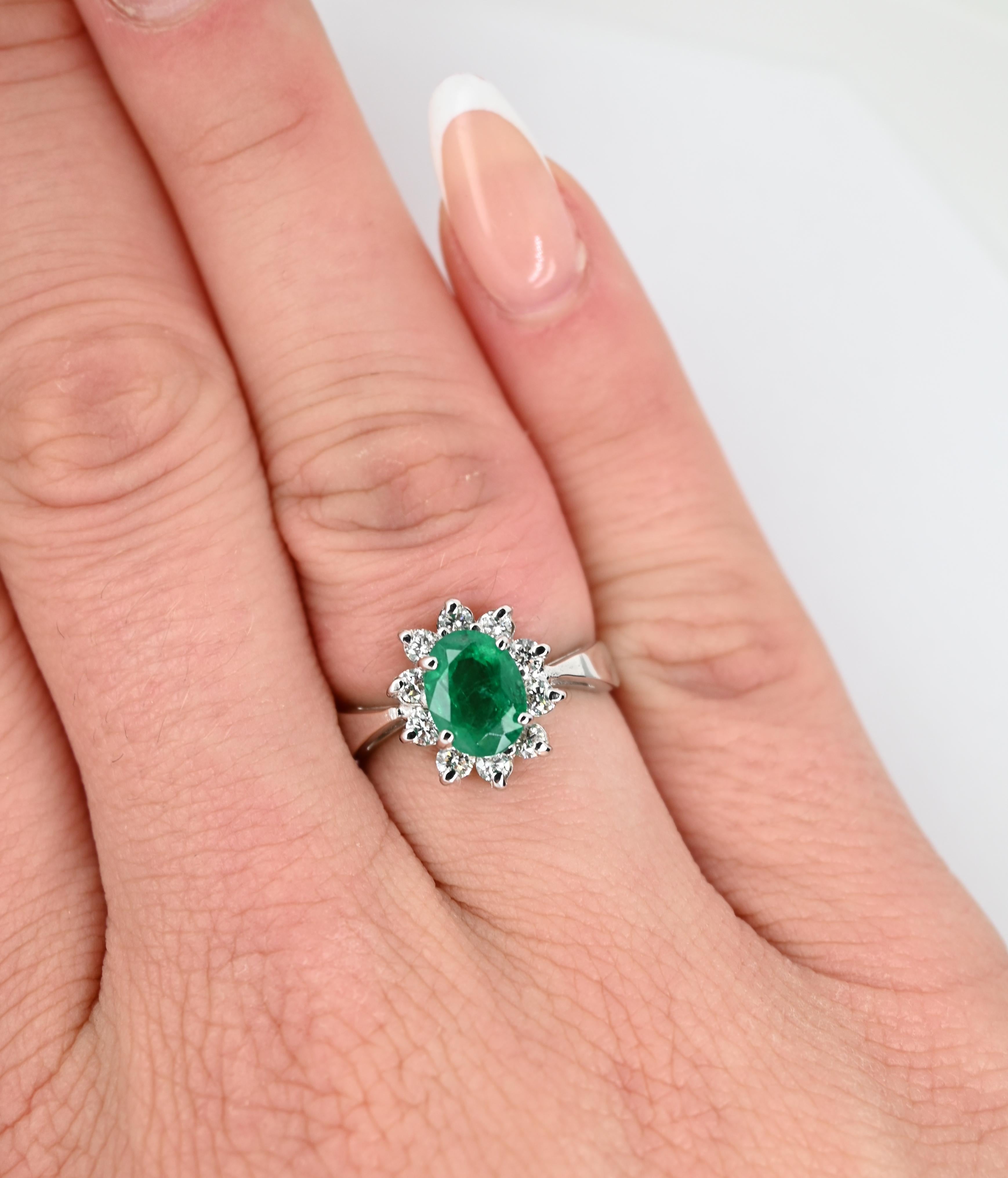 Original Magnum Creations design ring, features 0.54 carats of white diamonds and 1.10 carats of emerald as a center stone, mounted on a 14 karats white gold casting.

This ring is delicate, feminine and classic, resembles a flower shape and