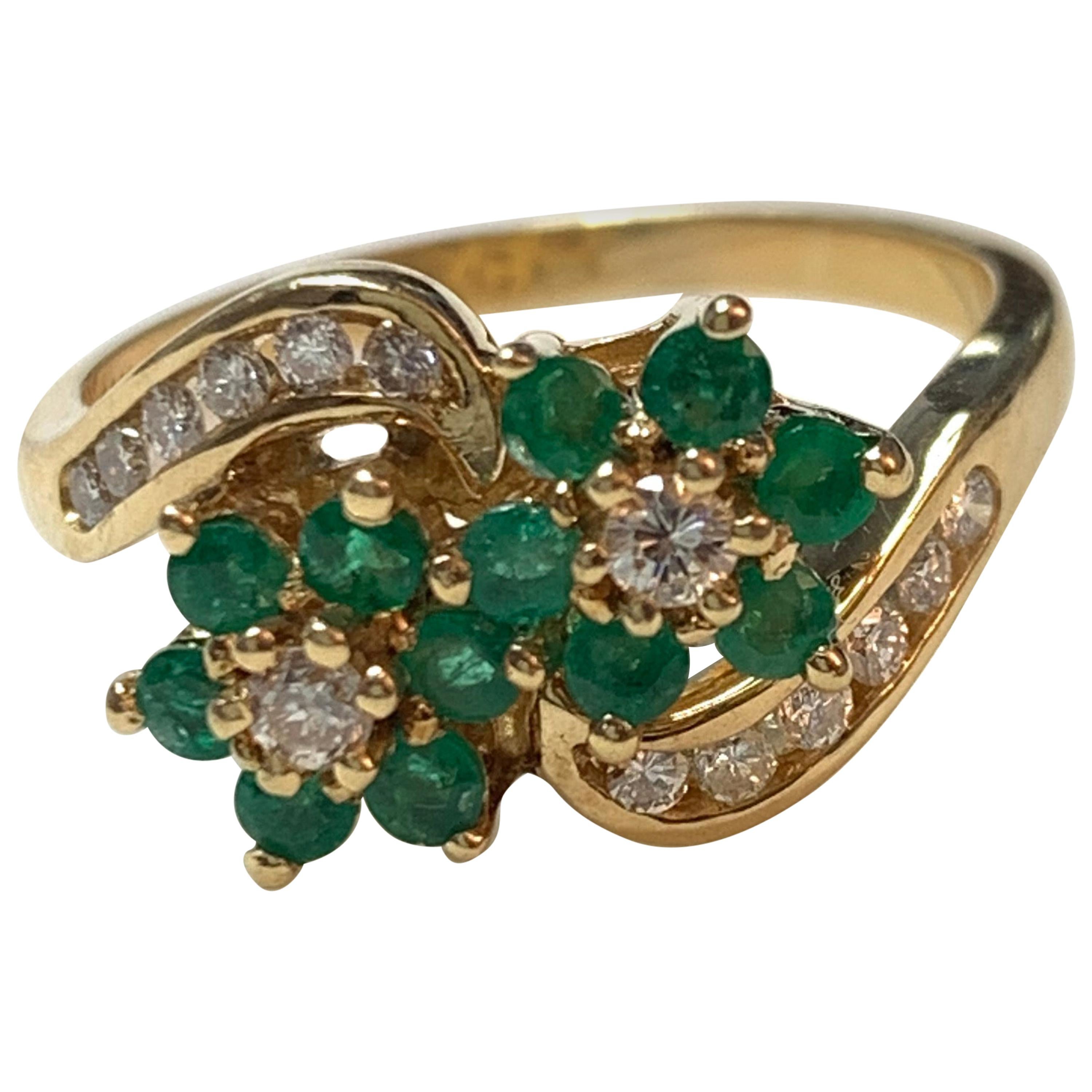 Diamond and Emerald Ring in 14 Karat Yellow Gold.