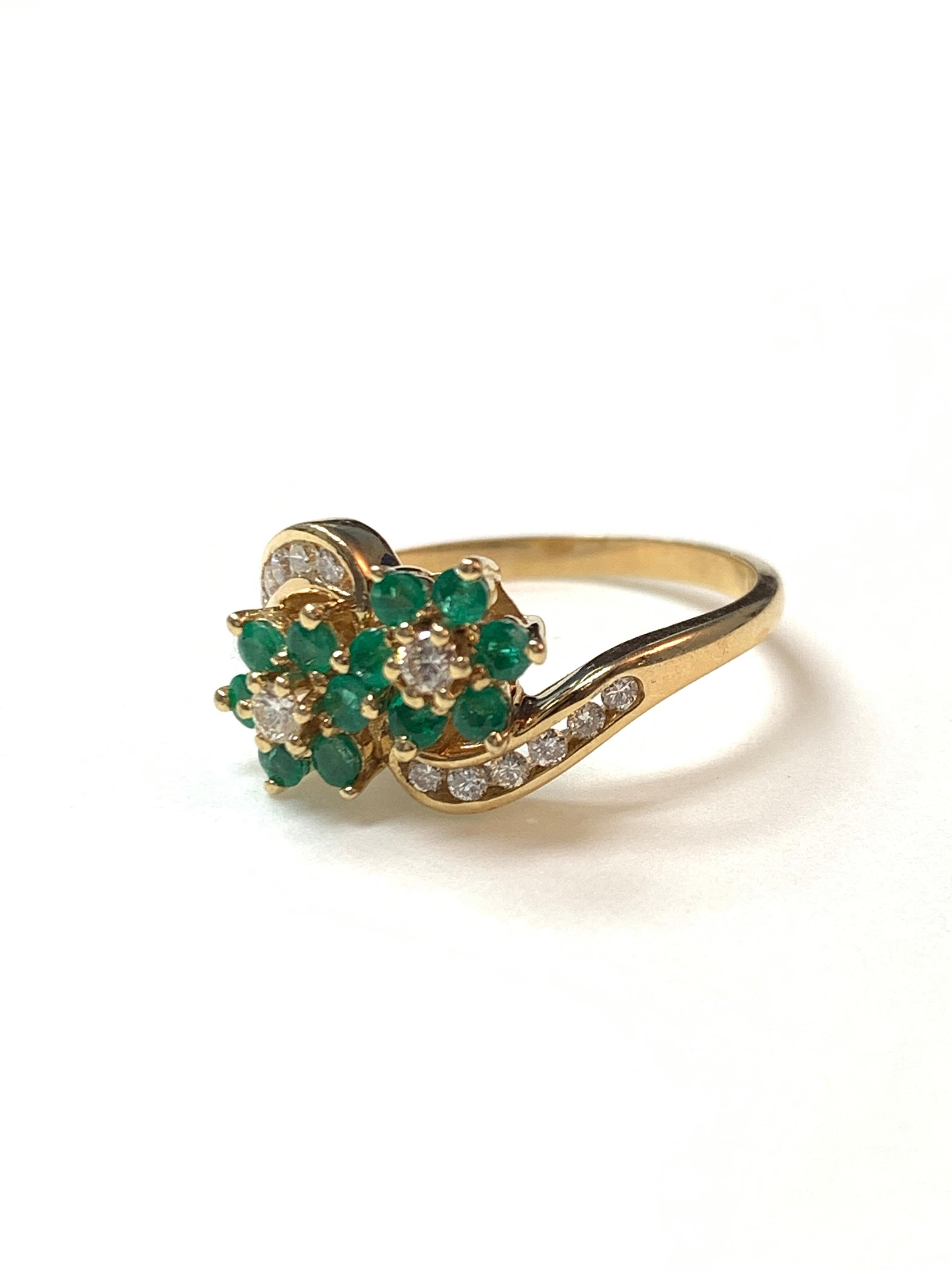 Women's Diamond and Emerald Ring in 14 Karat Yellow Gold.