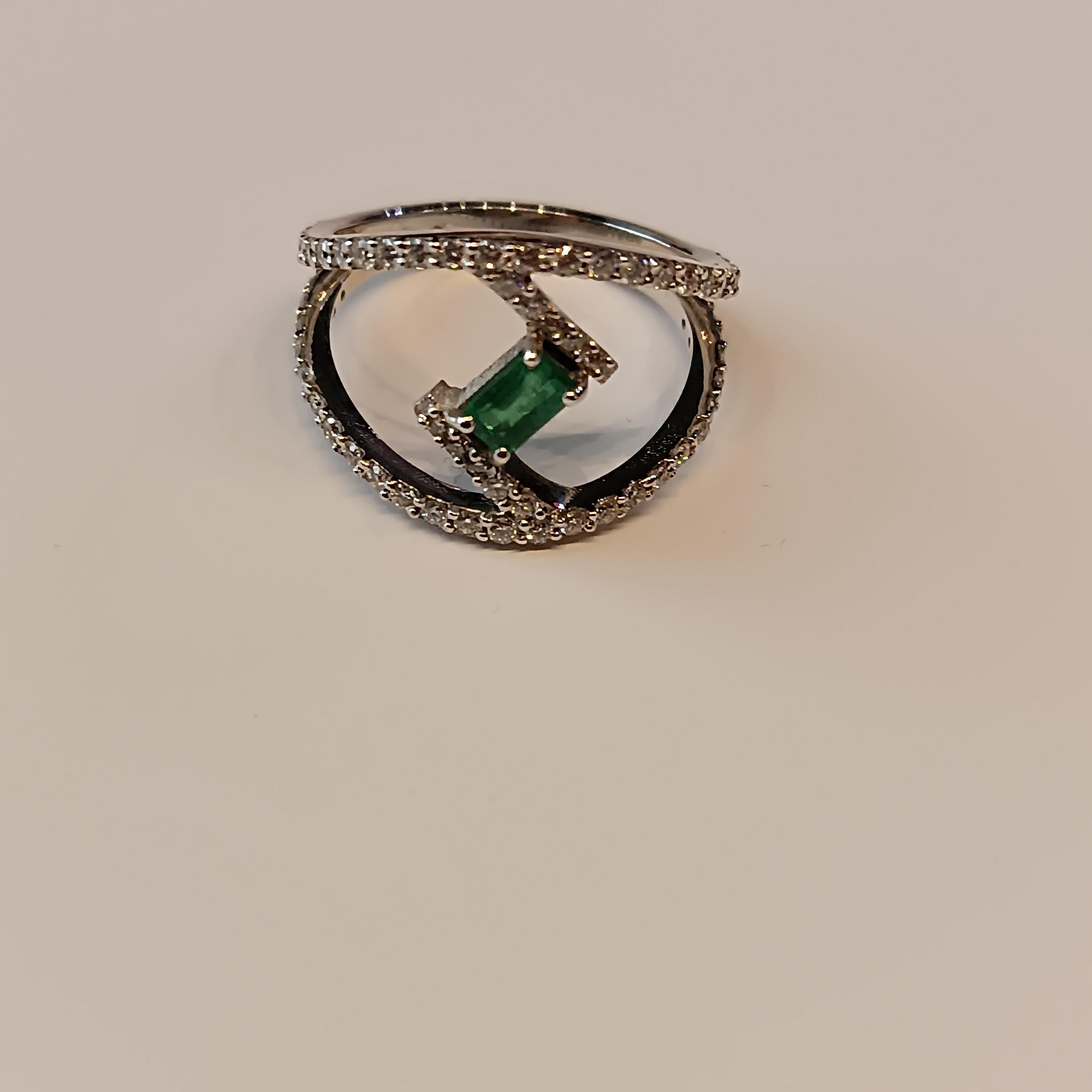 modern design 18 carat Withe gold Ring with VS G color. baguette cut emeralds of .03 carat each adorned with 0.64 diamonds for a total of 0.64 carats. total gross weight gr. 3.94 Ring size 54
This ring designed by Leo Milano is one of our bestseller