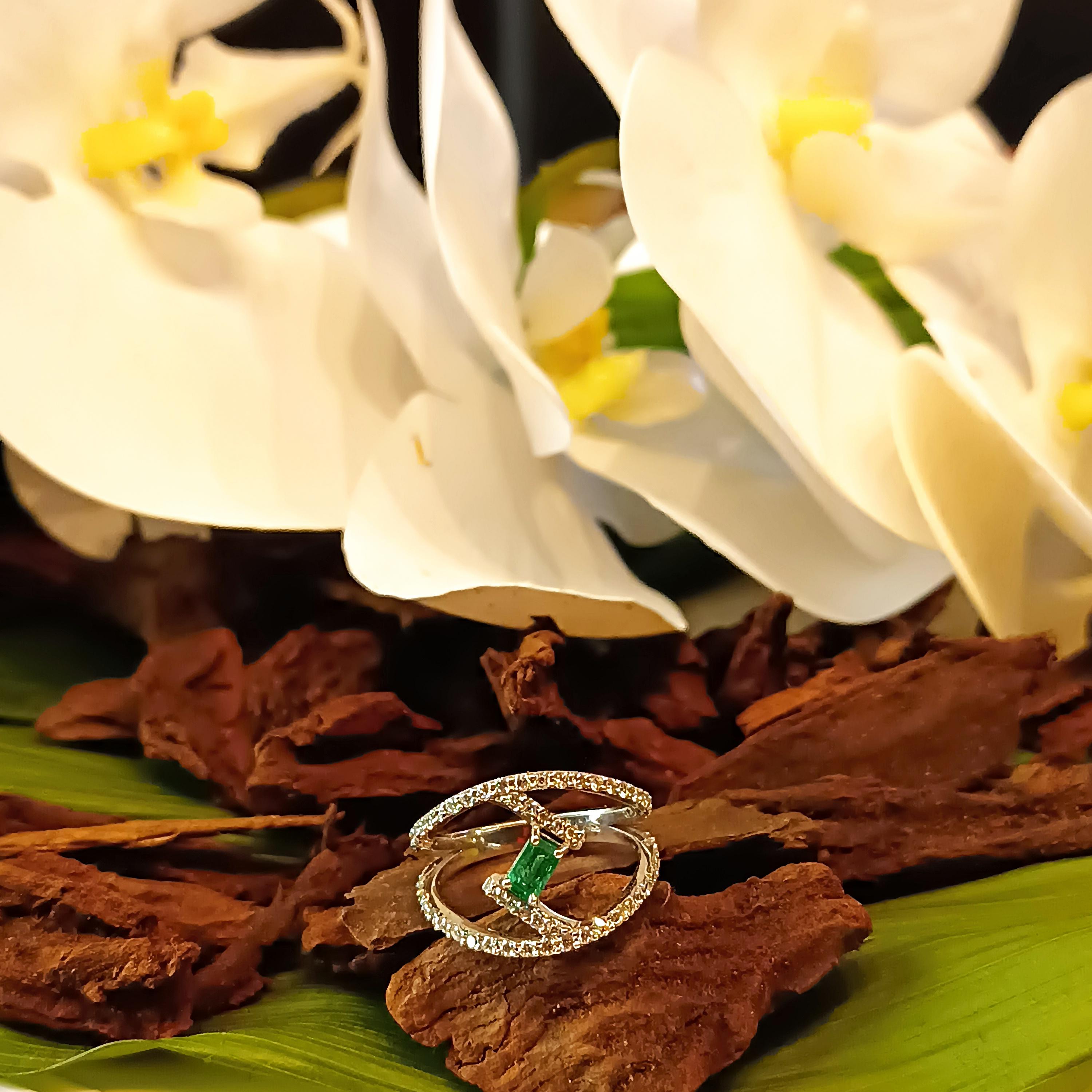Emerald Cut Diamond and Emerald Ring in Withe Gold 0.64 Carat Diamonds 0.3 Carat Emerald