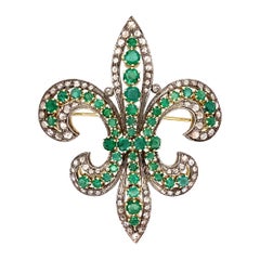 Broche Fleur-De-Lys en argent et or avec diamants et émeraudes - Bijouterie fine de l'État