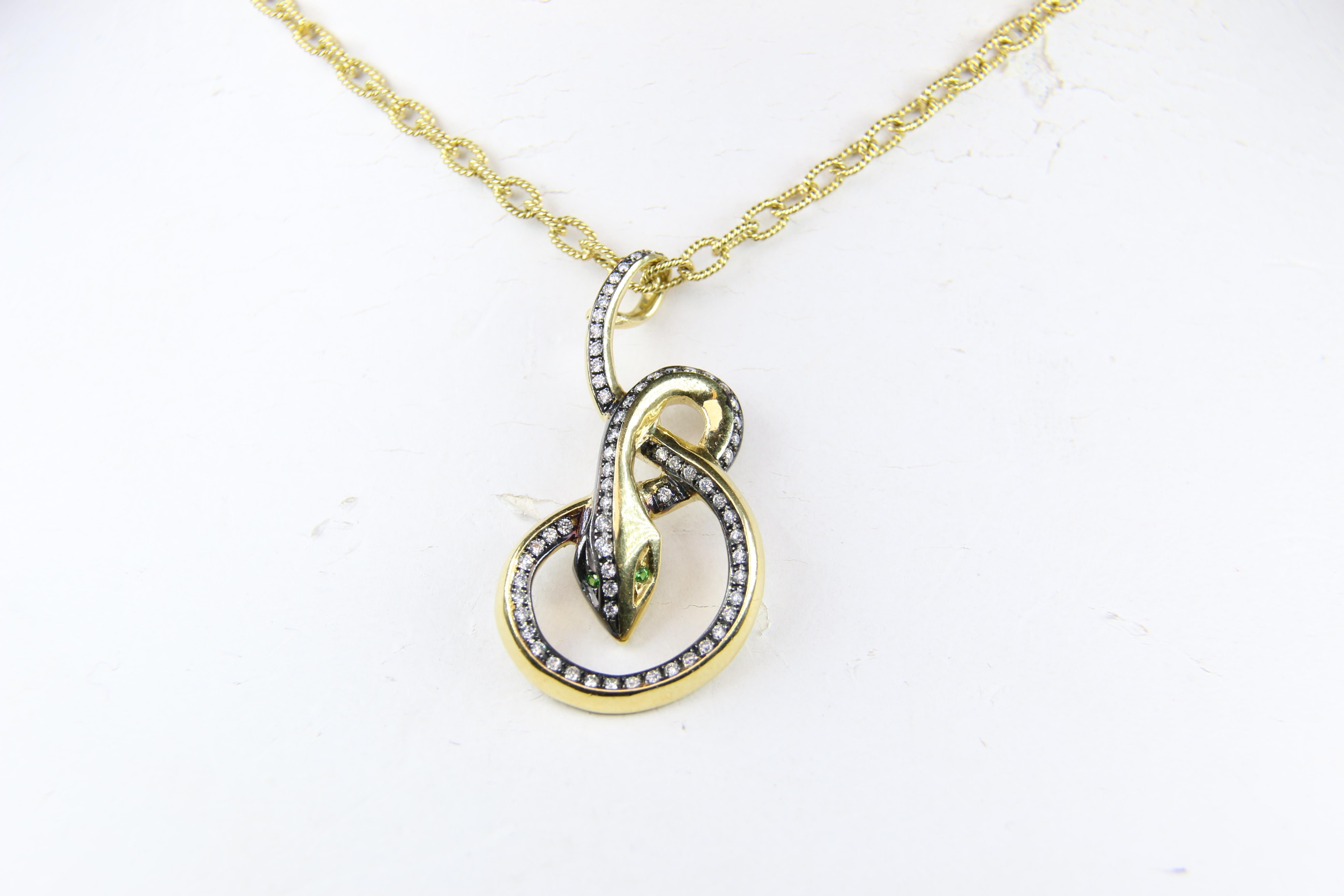Diamonds and Emeralds in a Snake Pendant Necklace.  Very chic! 