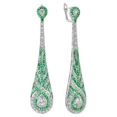 Diamond and Emerald Swirl Art Deco Style Dangle Earrings in 18K White Gold