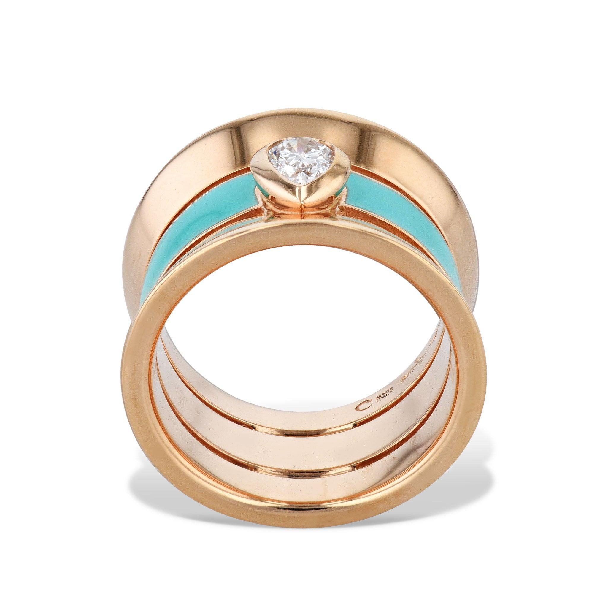 This sophisticated Diamond and Enamel 18K Pink Gold 3-Band Ring exudes elegance with a Pear Shaped Diamond, 3-band design featuring an air line center band in green enamel, and crafted from 18 karat Rose Gold.
Diamond and Enamel 18K Pink Gold 3-Band