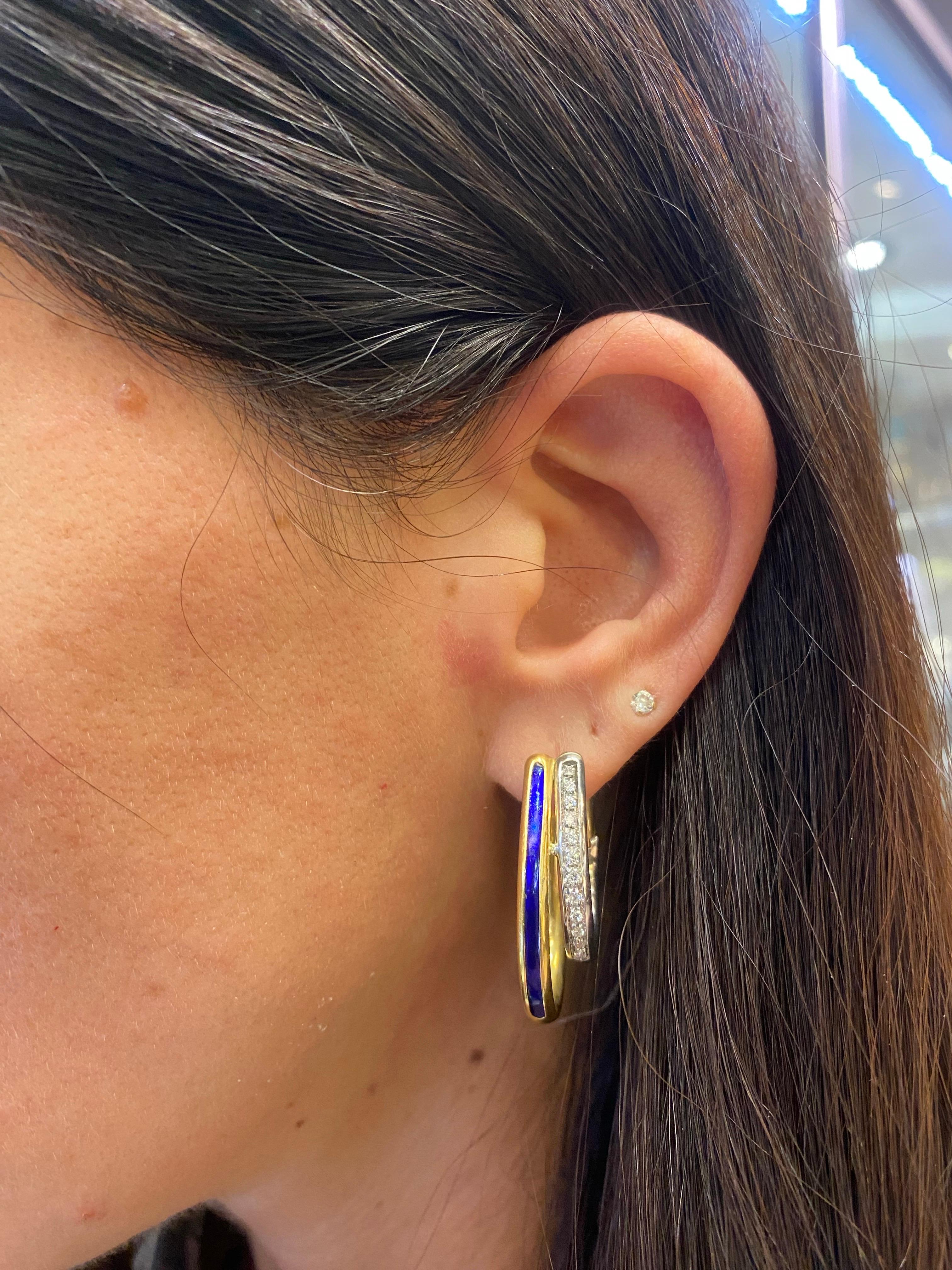 Diamond and Enamel Earrings 

A pair of two-tone earrings set with round cut diamonds and adorned with blue enamel 

Approximate Length: 1.25