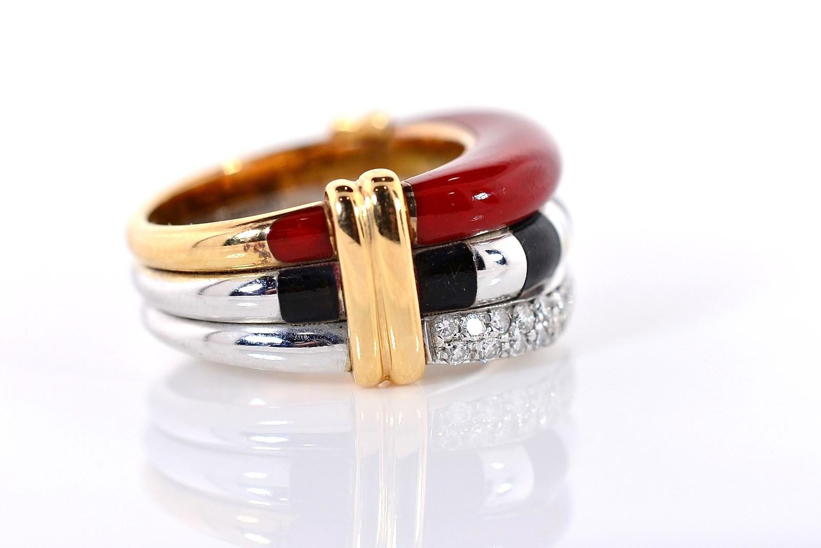 Substantially crafted of 18KT yellow/white gold, this well made ring features extremely sturdy Red & Black Enamel.  The three band design has one band of pave diamonds all weighing 0.50 carat.  Yellow gold banding accents the shoulders of this