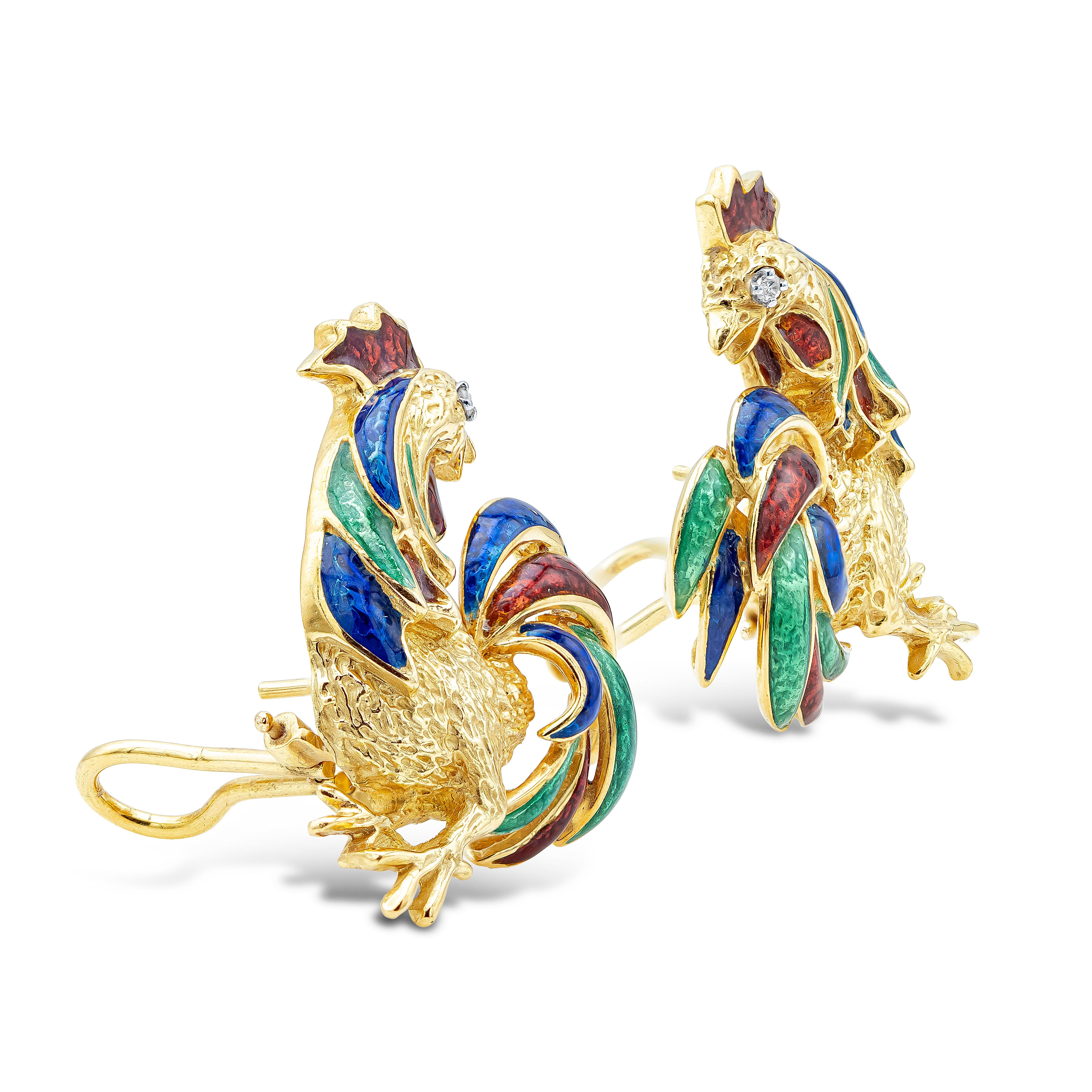 A unique pair of earrings showcasing a rooster made in 18k yellow gold, accented with diamond eyes and colorful enamel feathers. Omega Clip with post. 1 inches in width and 1.3 inches in length.

