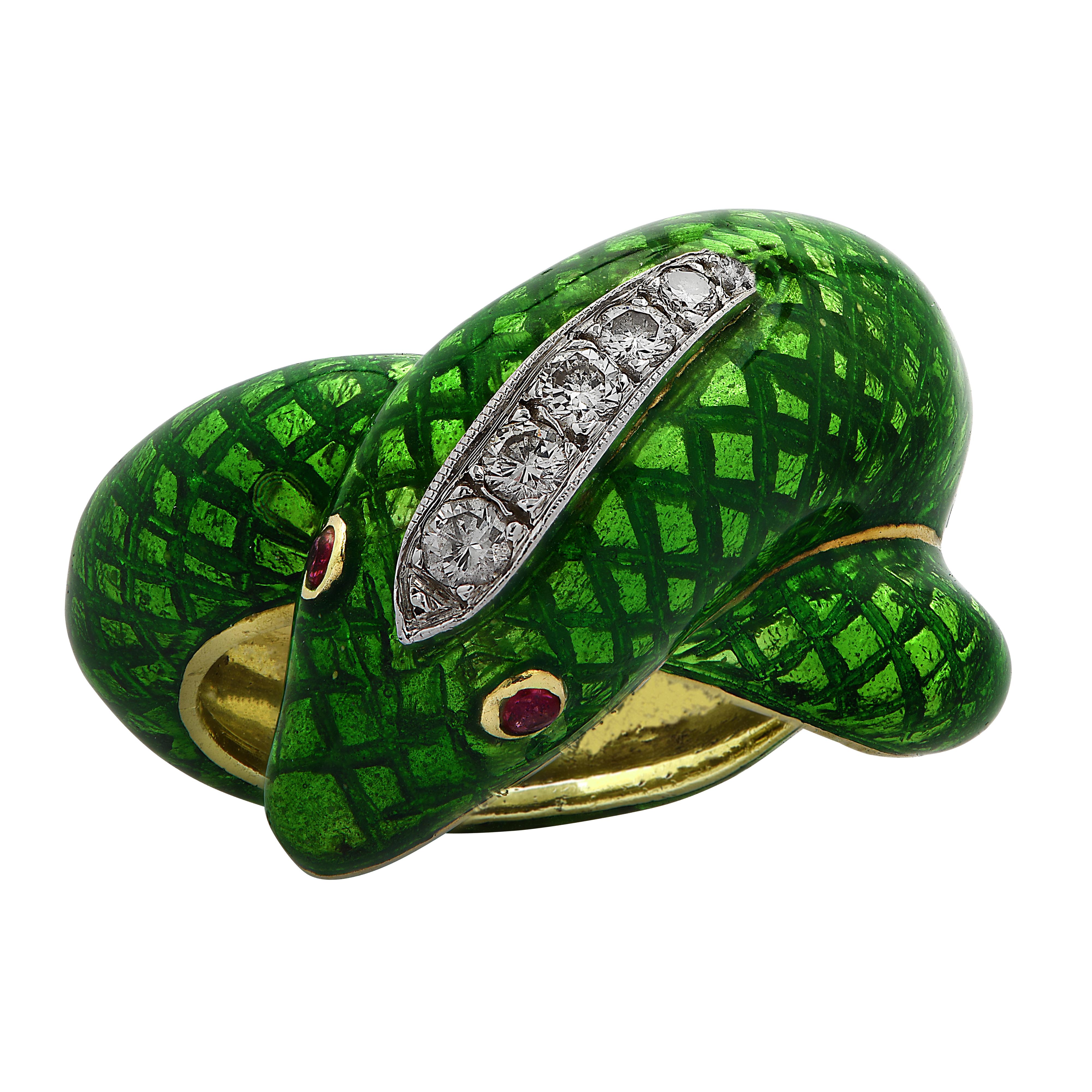 Sensational snake ring crafted in yellow and white gold and green enamel, featuring 6 round brilliant cut diamonds weighing approximately 0.20 carats total, G color, VS-SI clarity. The body of the snake is covered in green enamel scales and the head