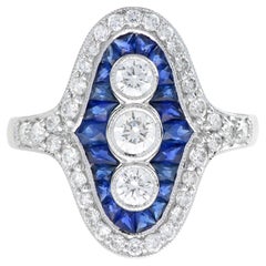 Anello a tre pietre con diamante e zaffiro taglio francese in oro bianco 18K