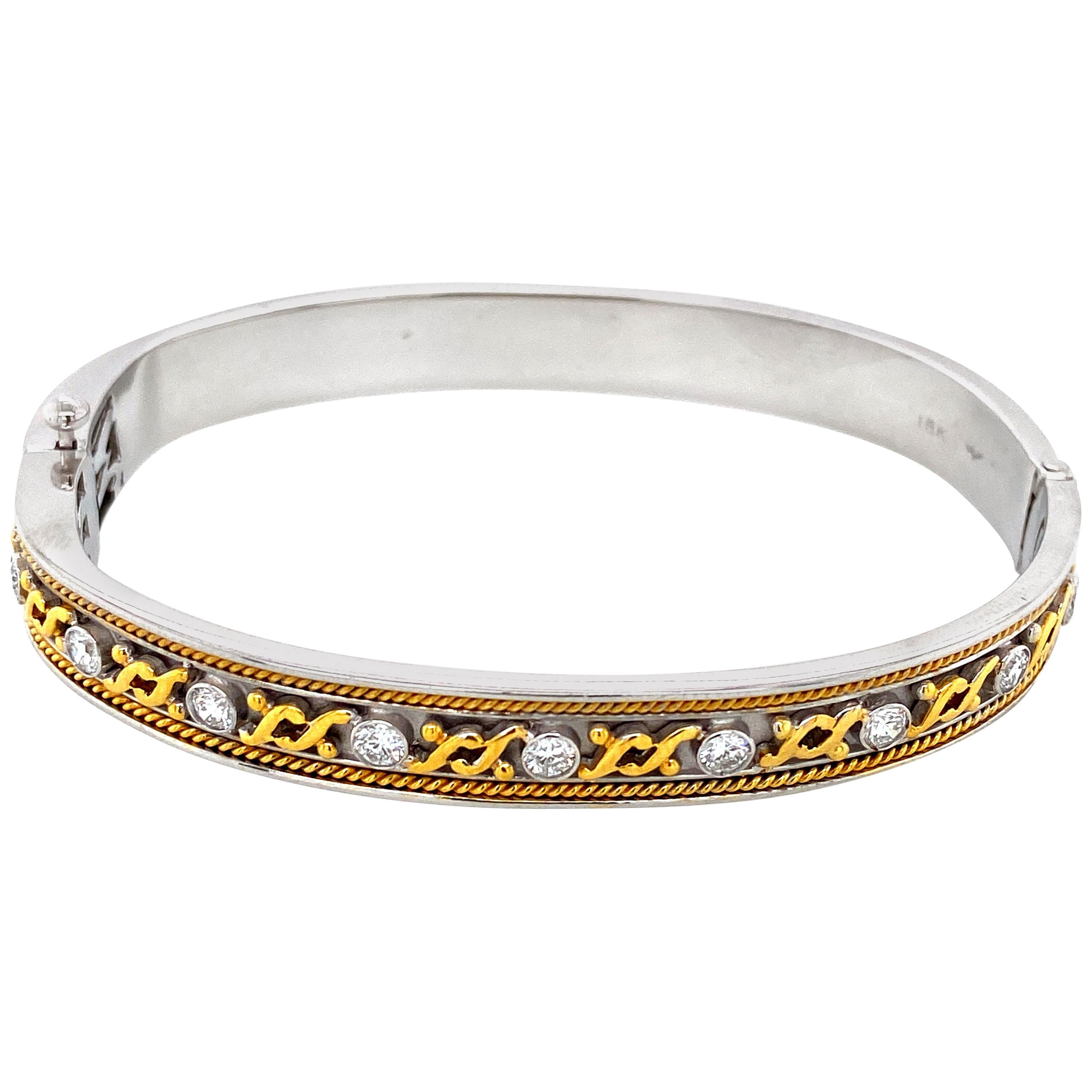 Diamond And Gold Bangle: 

An Art-Deco inspired Diamond and Gold Bracelet, with detailed craftsmanship to make sure the bracelet stands out! It is seldom that one sees gold detailing in such finesse as done on this bracelet, truly magnificent. The