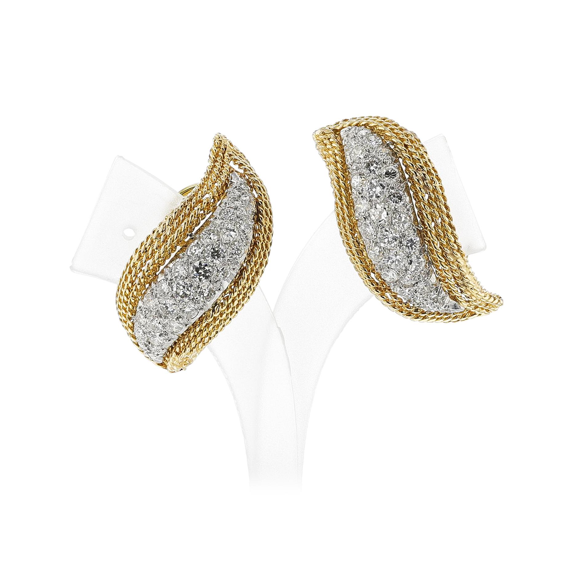 A pair of Diamond and Gold Earrings made in 18k Gold. Pavé-set with full and old European-cut diamonds, approximate total weight 2.40 carats, weight 14.36 gram. Length: 1 1/4 inches.

SKU: 1464
