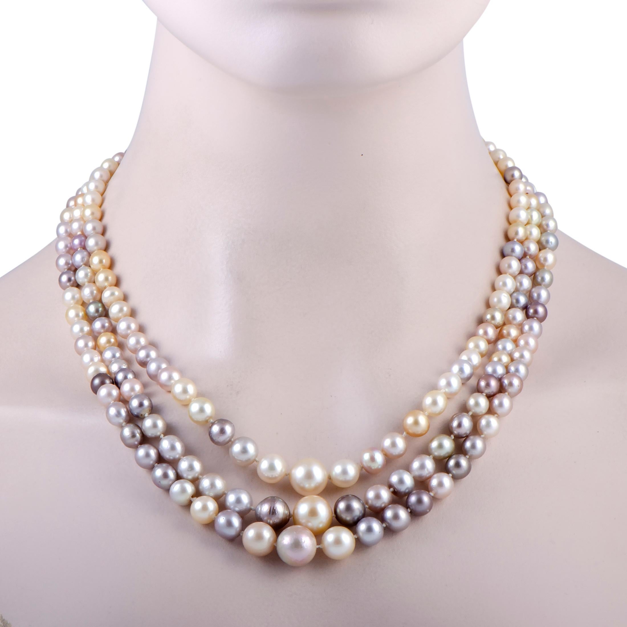 Add a splendidly classy touch to your ensembles with this sophisticated necklace that boasts three strings of gorgeous pearls of diverse sizes and colors, ranging from 4mm-12.5mm, offering an enchantingly feminine appearance. The clasp is made of