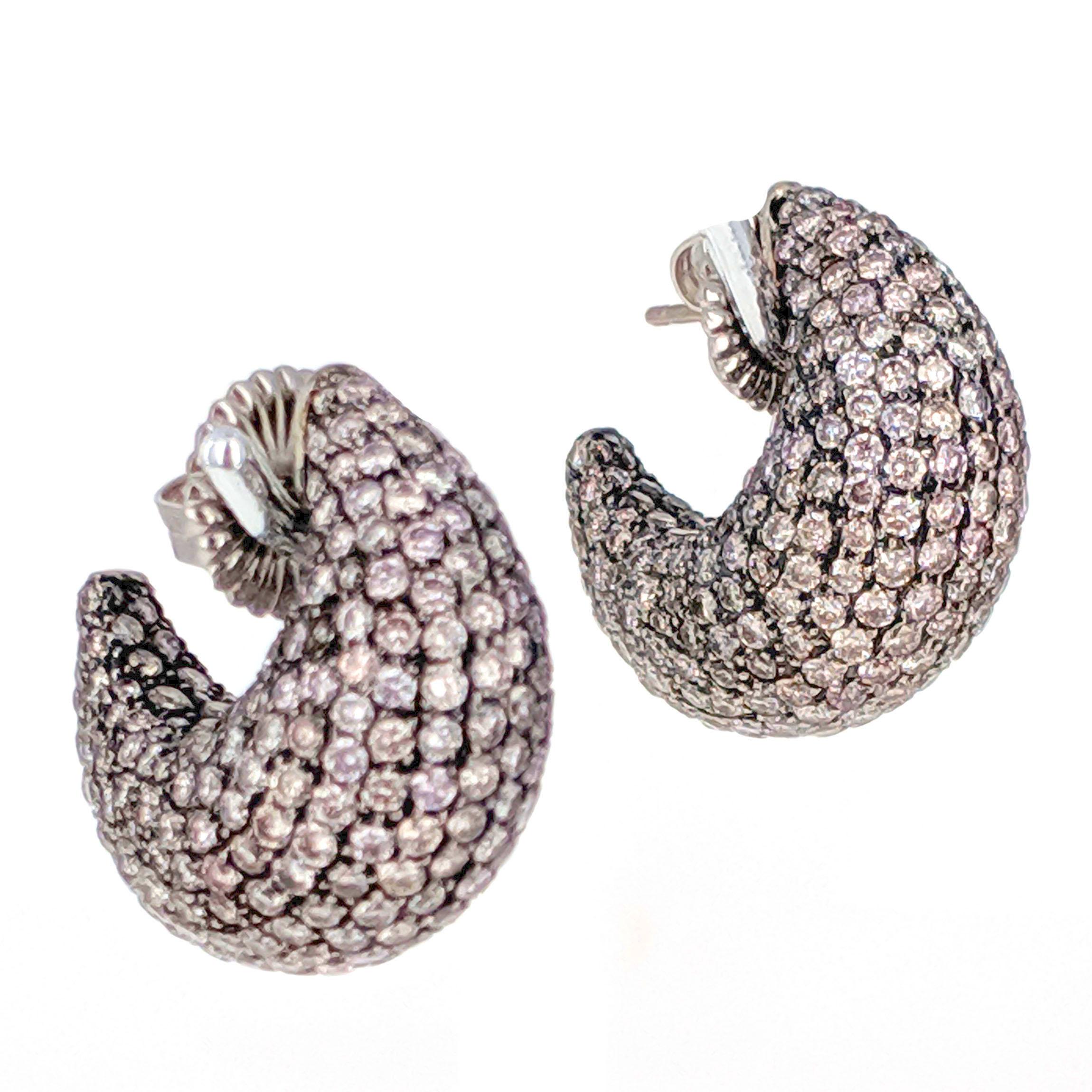 A pair of elegantly shaped bombe earrings pave-set with round-cut light brown diamonds weighing approximately 6 carats in total. Mounted in blackened 18 karat gold. Bold and feminine, the blackened gold contrasts against the warm diamonds.