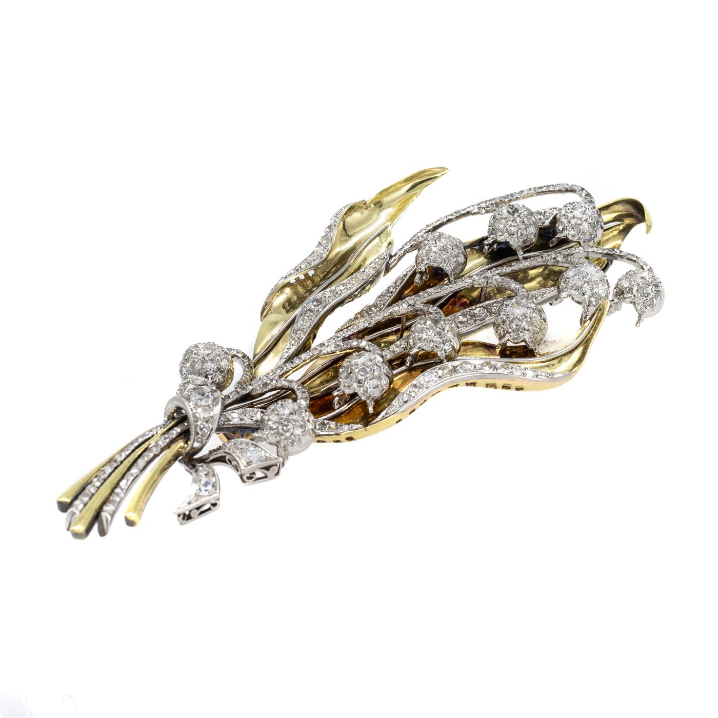 A lily-of-the-valley brooch, set with rose-cut, eight-cut and old-cut diamonds, mounted in yellow and white gold, with articulating flower heads, in an Alexandre Loeb, Sao Paulo, red velvet box, circa 1940.