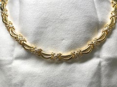 Diamond and Gold Necklace of Ribbons and Cross Design