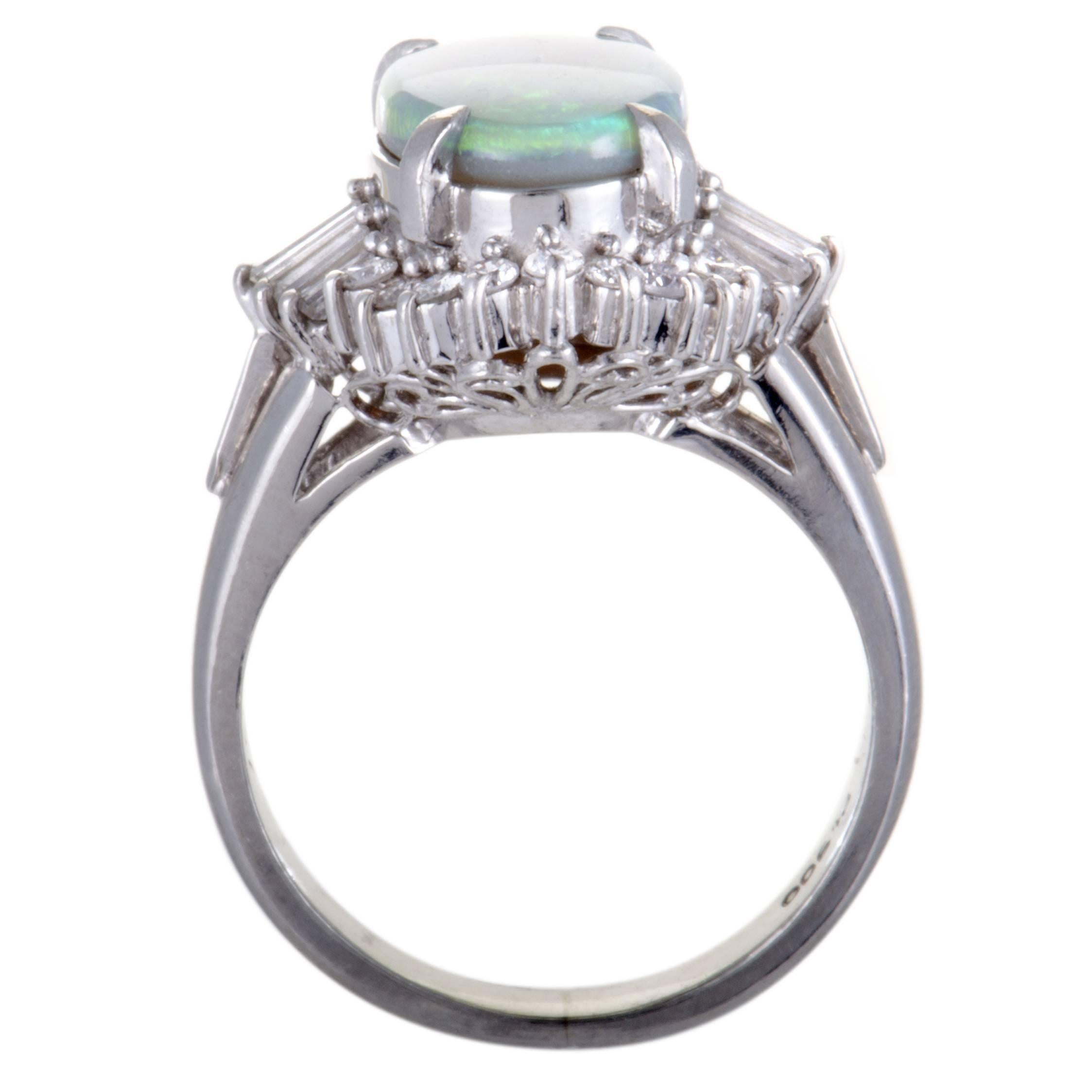 This beautiful platinum ring epitomizes elegance and class. The spectacular ring is adorned in a sparkling pave of 0.57ct diamonds that surrounds a dazzling green opal, weighing 1.93ct, that gives the ring an extravagantly stylish appeal.
Ring Top