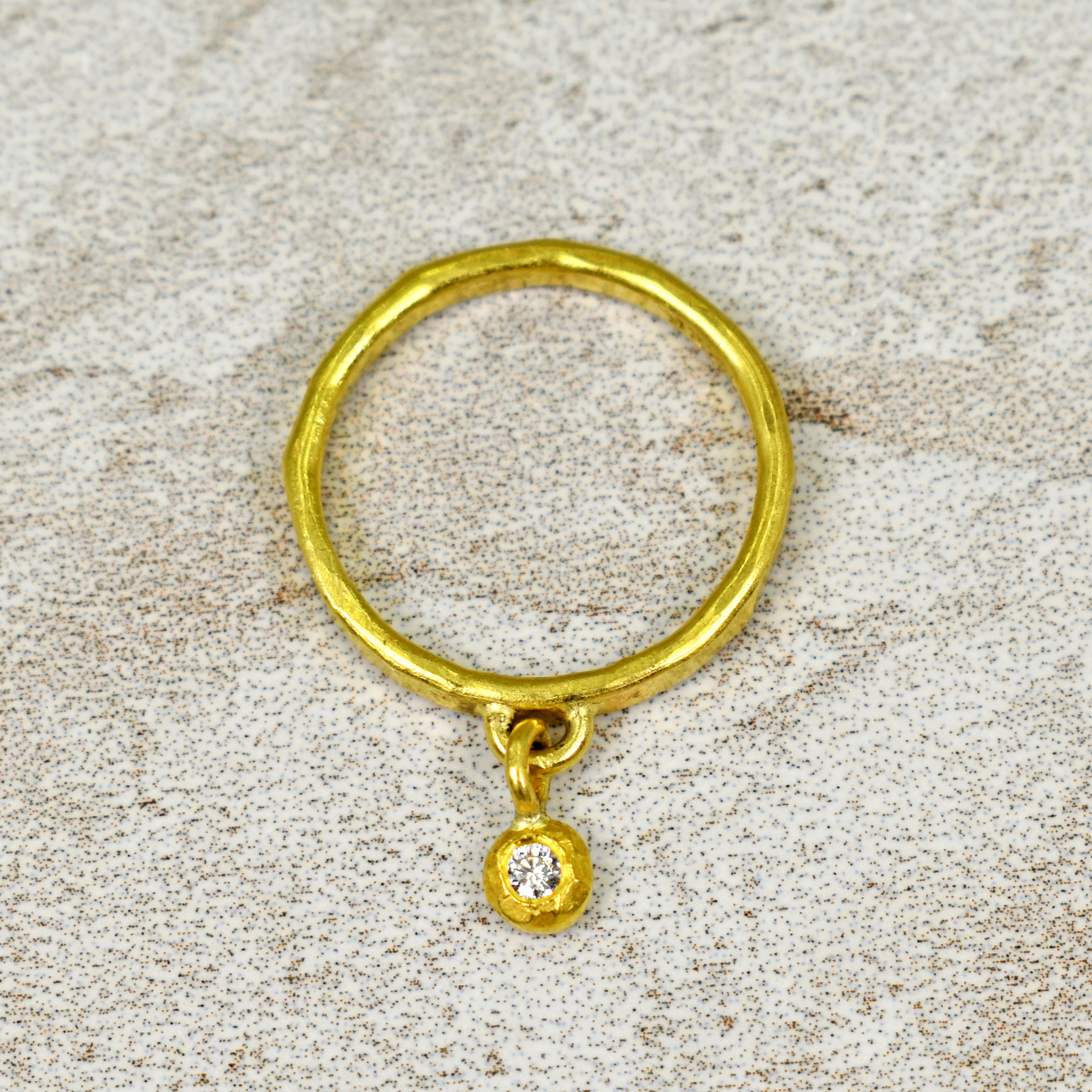 Hand-forged, hammered 22k yellow gold ring with 2mm white Diamond charm. Size 7. Ring band is 3mm wide and finished with a rustic texture. Perfect on its own or added to your ring stack. 