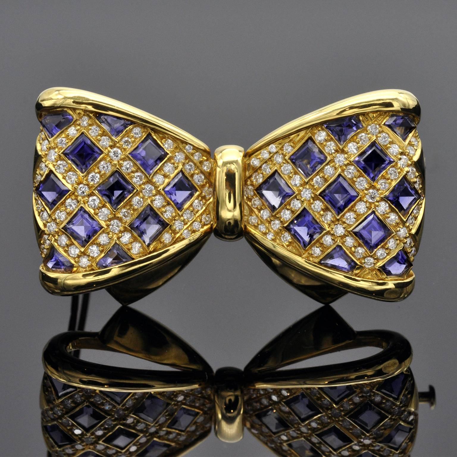 Classy square Iolite and diamond bowtie brooch.
Diamond: ± 2 carat G VS or better
18kt Gold 
