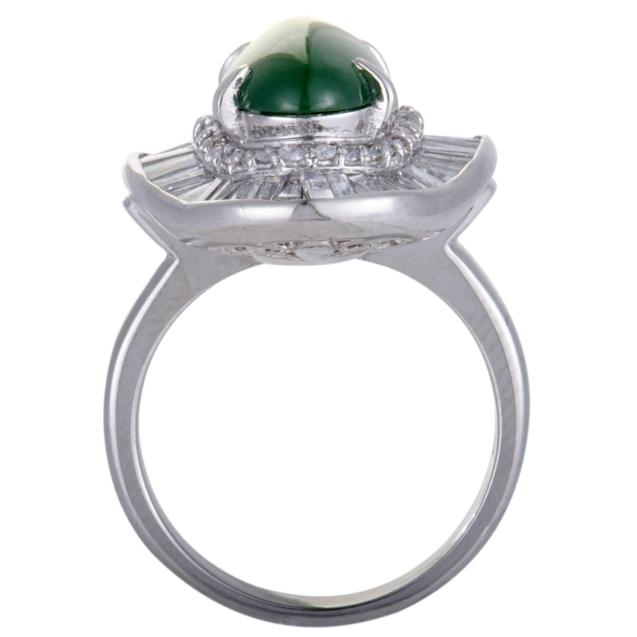Beautifully crafted in shimmering platinum, this gorgeous ring is absolutely exemplary in design and style. The stunning ring has an exquisite pave of dazzling 1.55ct diamonds surrounding a stunning green jade stone of 3.42ct that accentuates the