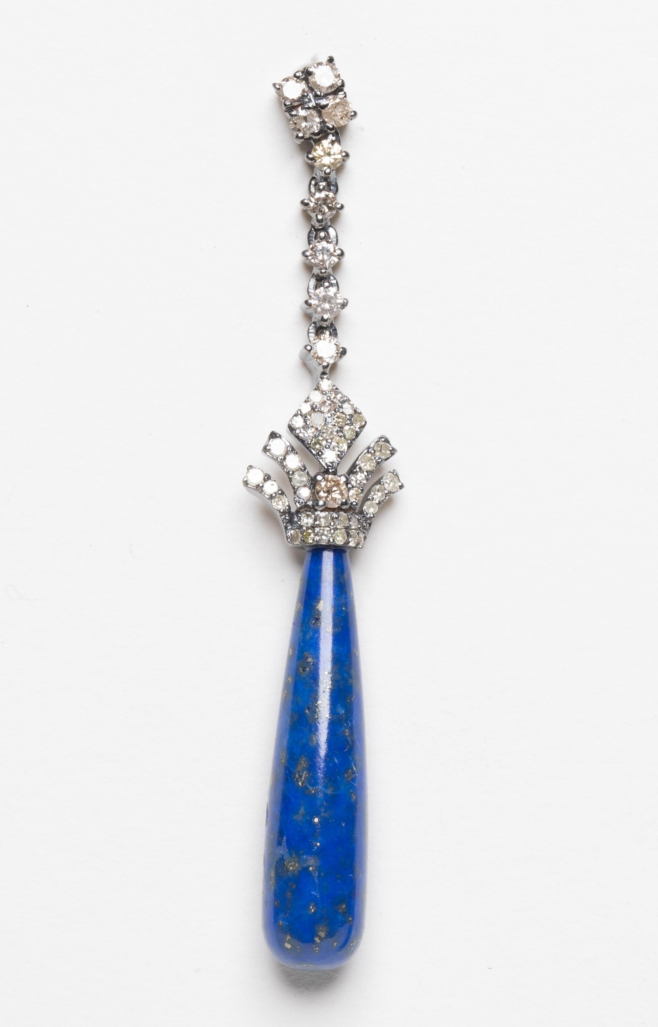 A stunning pair of round, brilliant cut diamonds set in sterling silver with a long lapis lazuli drop held by a crown of diamonds.  18K post for pierced ears.   Diamond weight totals 1.51 carats, lapis totals 24.80 carats.

The fine jewelry