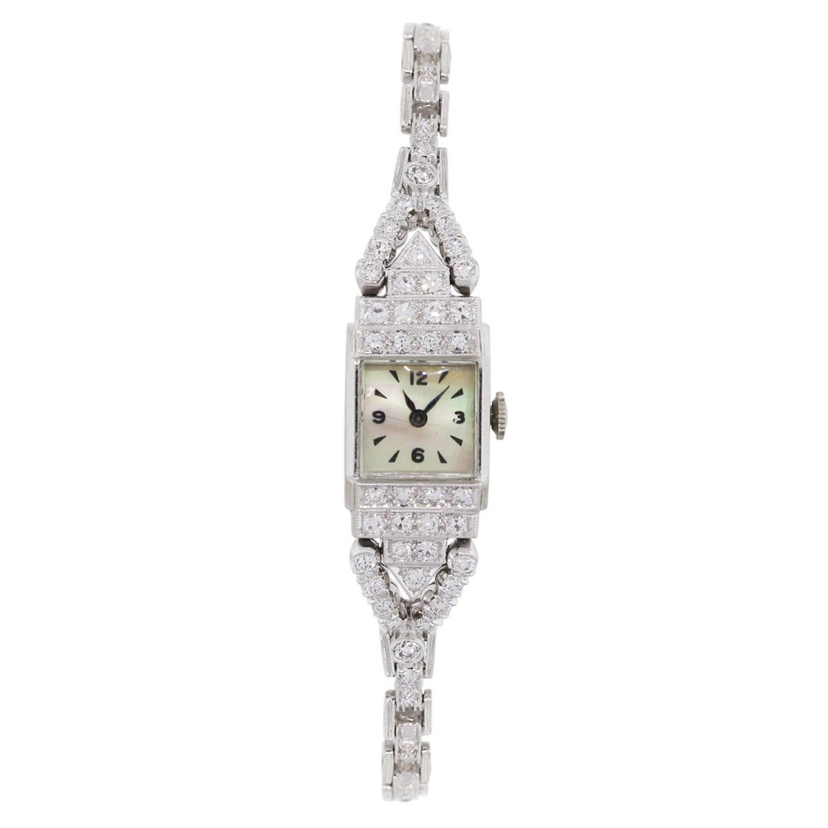 Case Material: Platinum
Diamond Details: Approximately 2.20ctw of round brilliant diamonds. Diamonds are G/H in color and SI in clarity
Dial: Mother of pearl dial with black hour markers
Bracelet: Platinum diamond pave bracelet
Case Measurements: