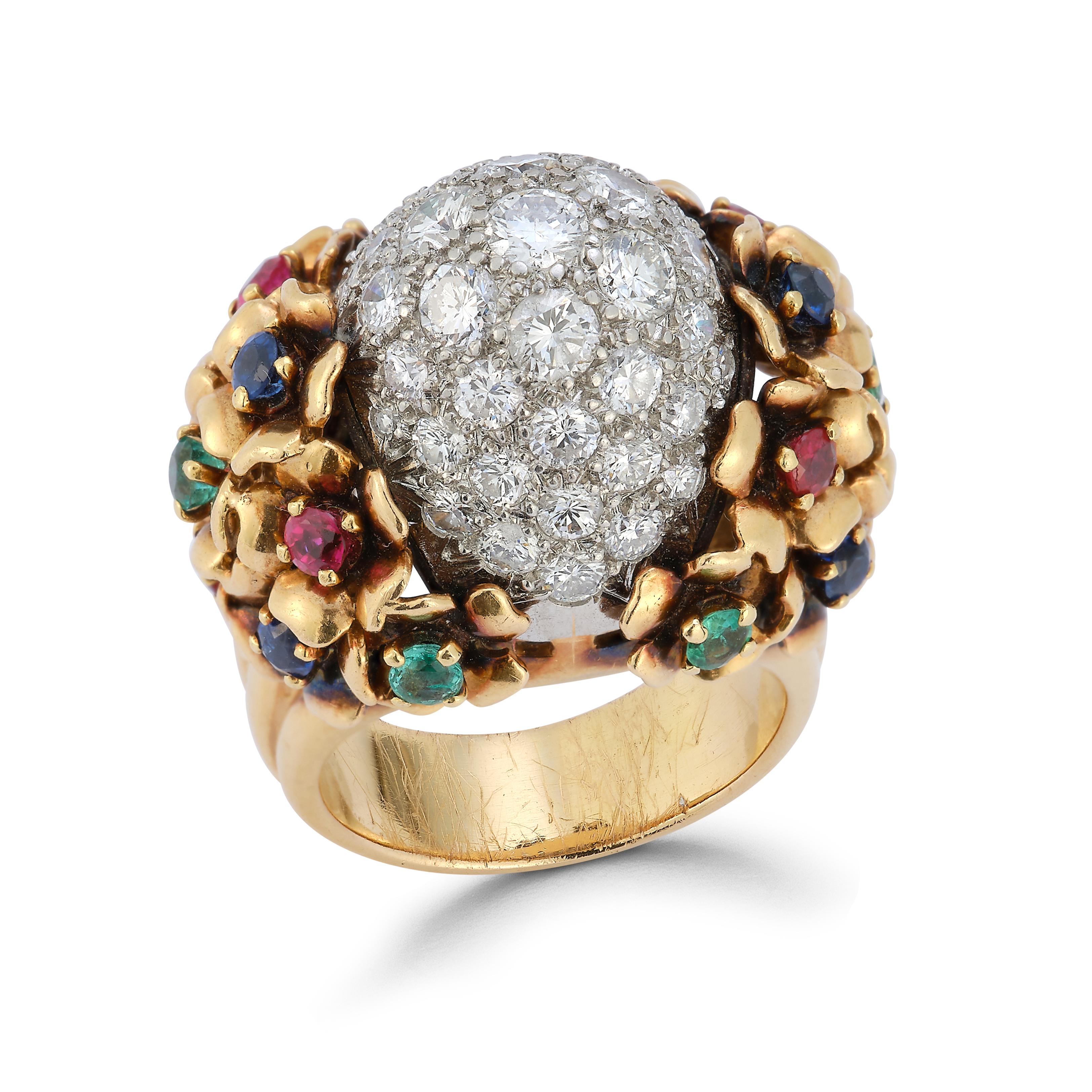 Diamond and Multi Gem Cocktail Dome Ring

Accented with rubies, sapphires, and emeralds.

Made circa 1940

18 Karat gold

Ring Size: 7.5

Sizable to any size