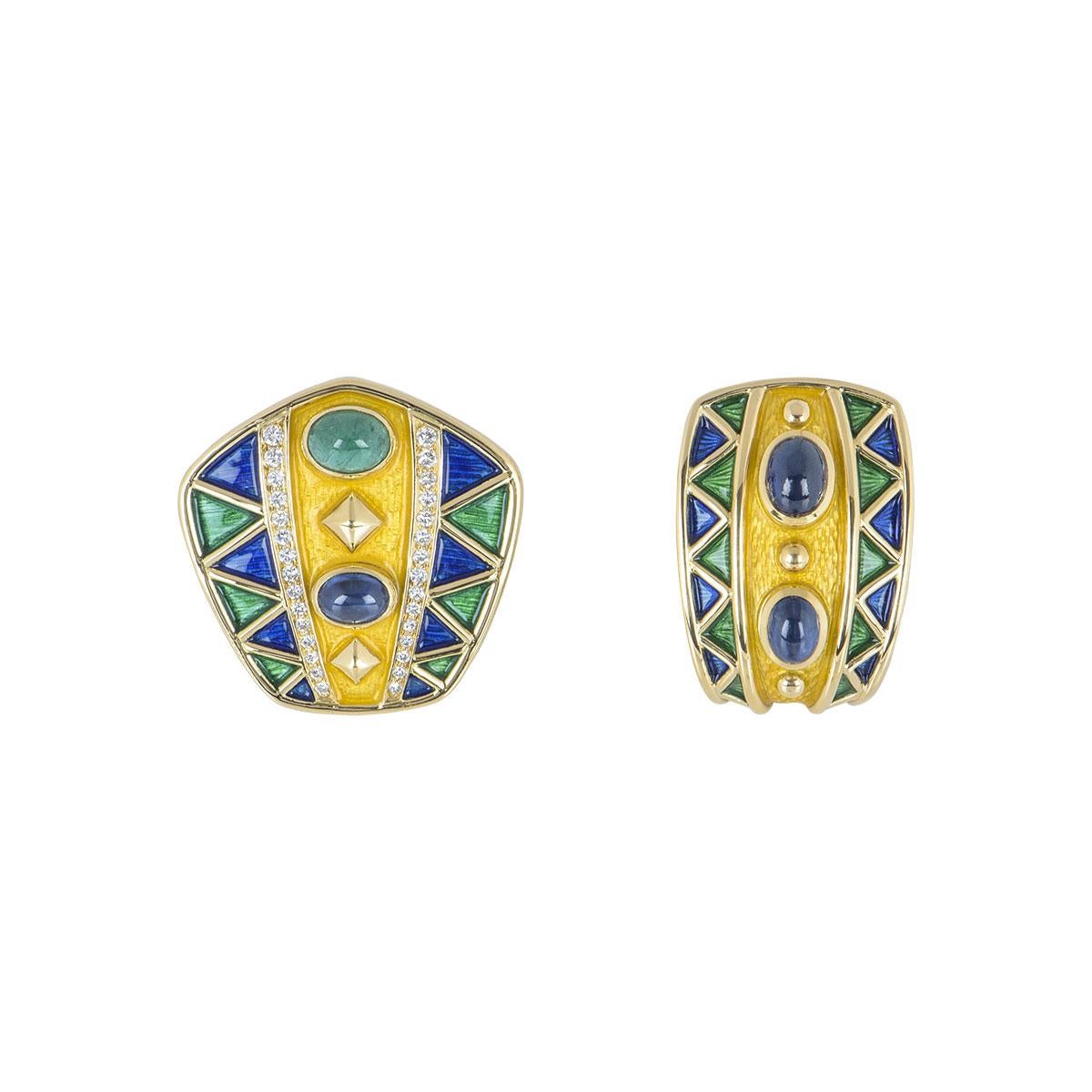 An 18k yellow gold diamond and multi-gem suite. The suite is composed of earrings and ring, pave set with round brilliant cut diamonds, cabochon shaped emeralds and sapphires evenly spaced with shaped blue, yellow and green lacquer. The earrings are
