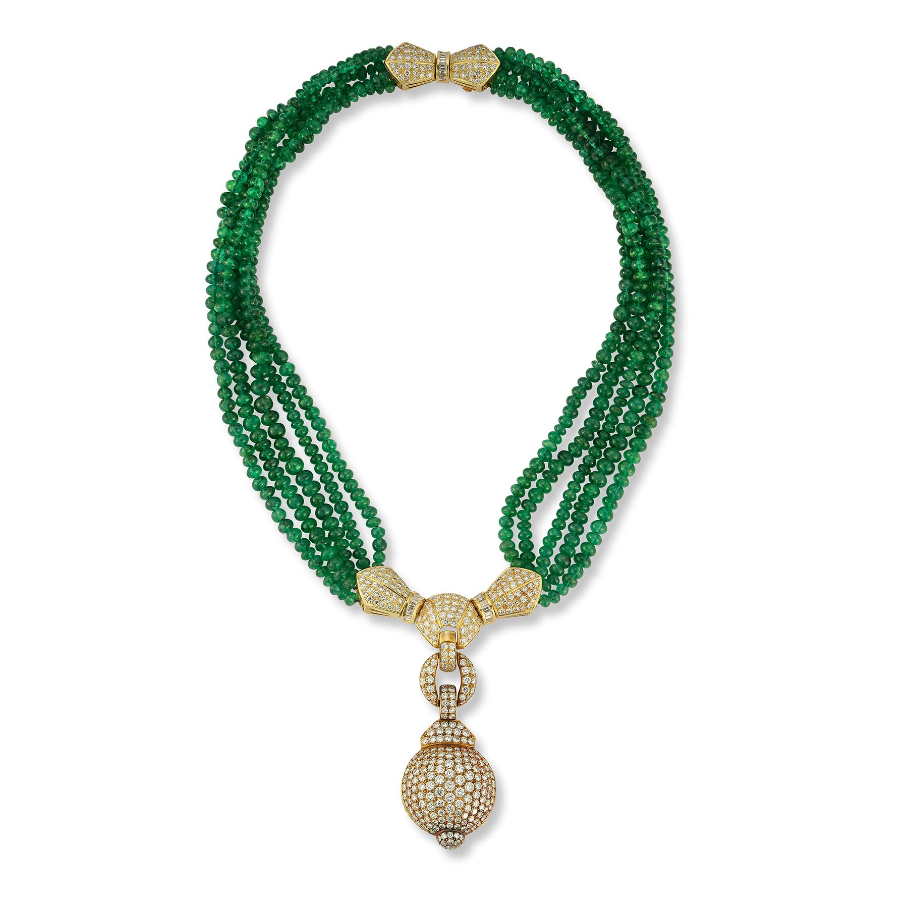 Diamond and Multi Strand Emerald Bead Necklace 
18K Yellow Gold. 
Five strands of emerald beads weighing approximately 258 carats, connected to pave diamond yellow gold centerpieces Diamond weigh approximately 14 carats.
Measurements:  16