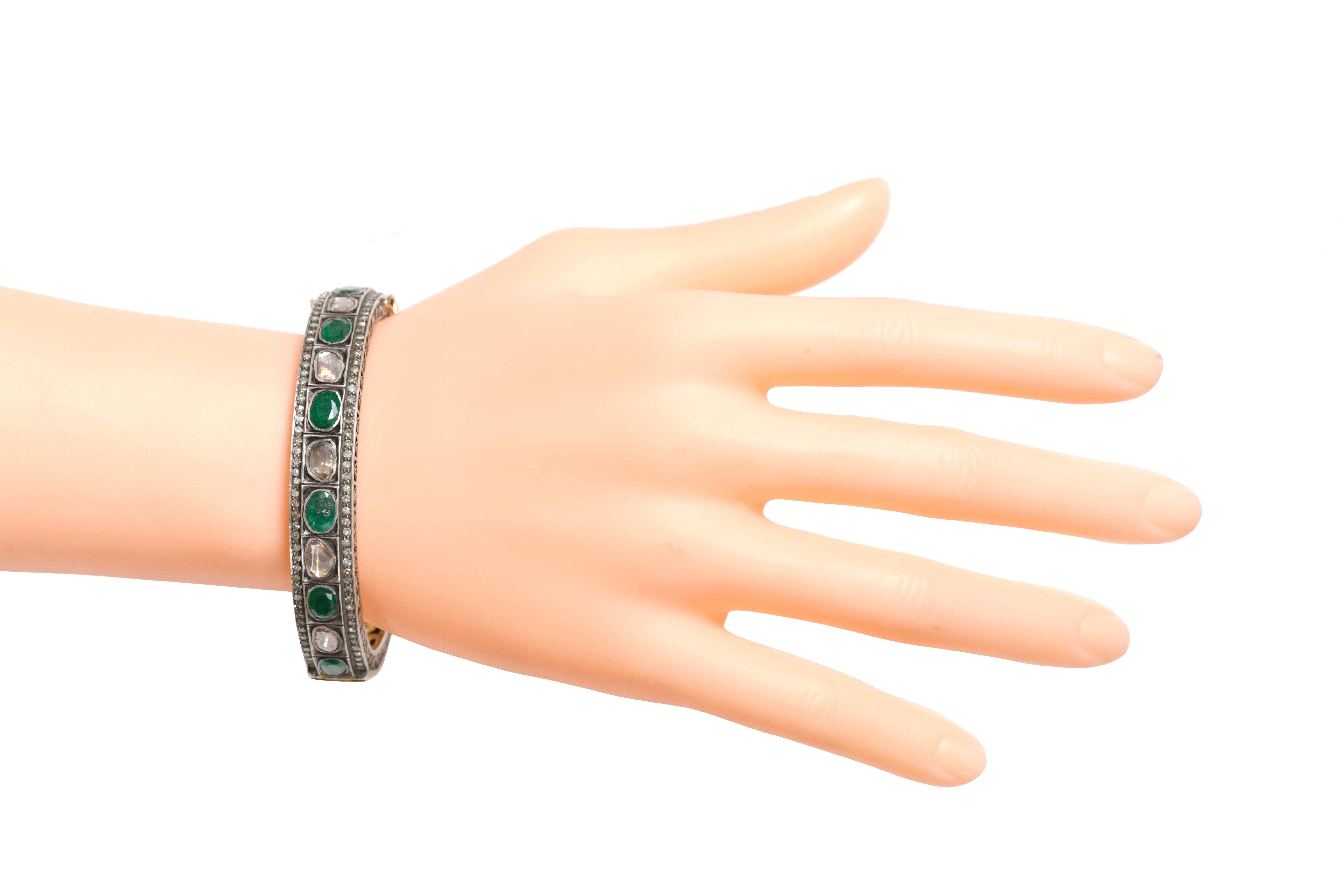Oval Cut Diamond and Natural Emerald Tennis Bangle in Art Deco Style  For Sale