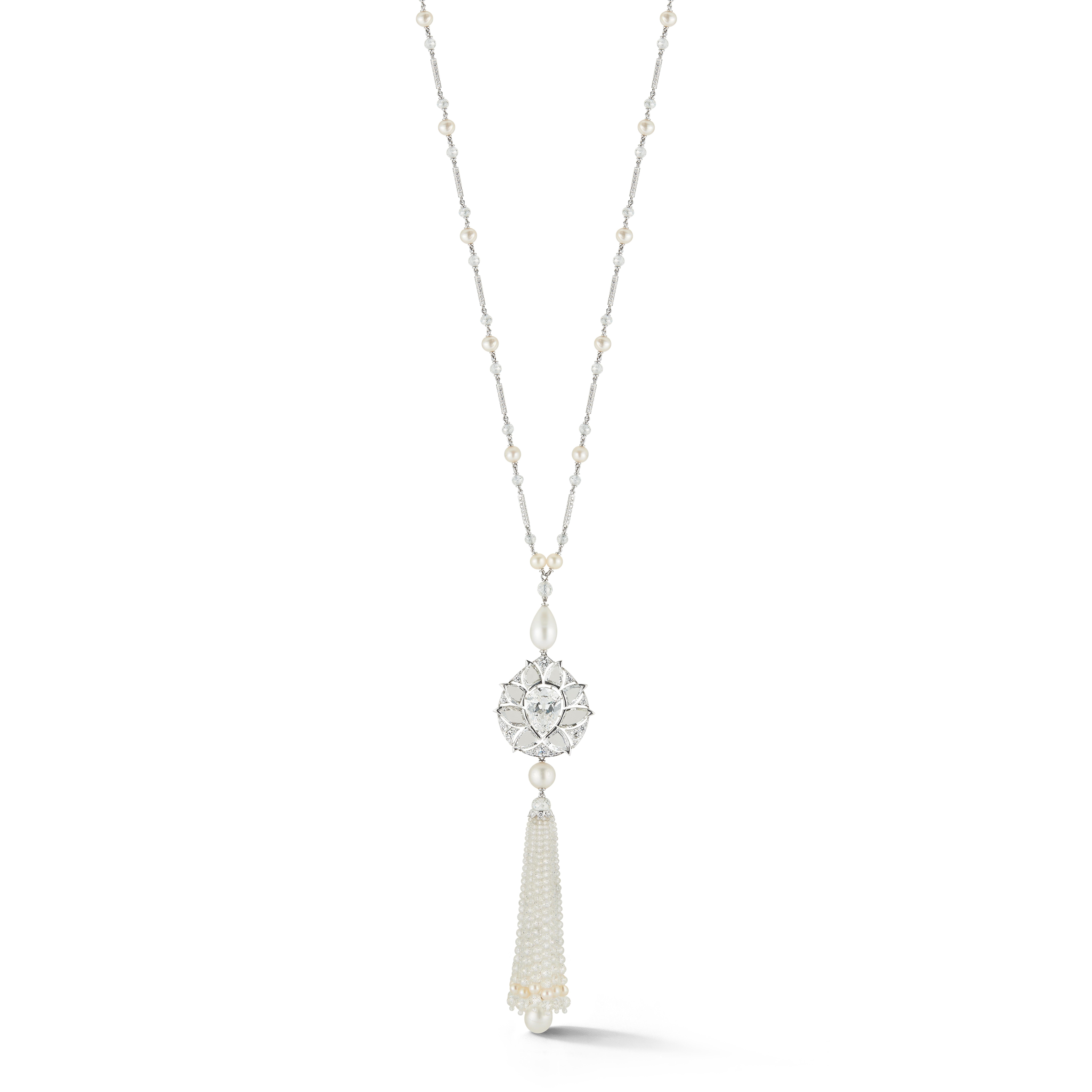 Diamond and Natural Pearl Tassel Sautoir Necklace Masterpiece by Viren Bhagat

Center antique old mine pear shape GIA certified diamond is 5.03 ct G color, VS2 clarity framed by 8 very impressive table cut (or rose cut) diamonds. 

The tassel is
