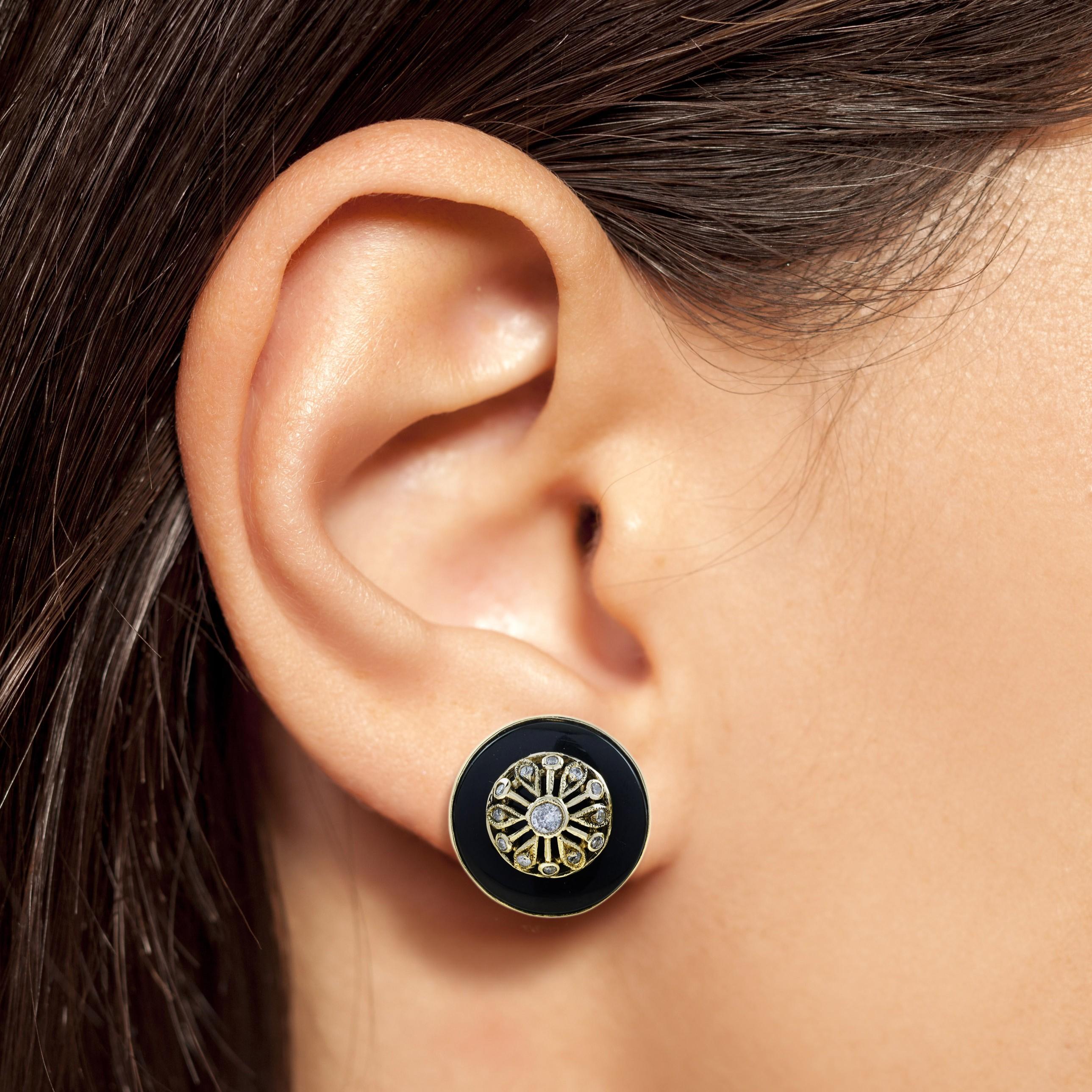 Feature a diamond at the center, arranged in a floral design, with a sleek onyx border encircling it. The combination of the sparkling diamond and smooth onyx gives the earrings a posh and elegant feel, making them perfect for daily wear. Their