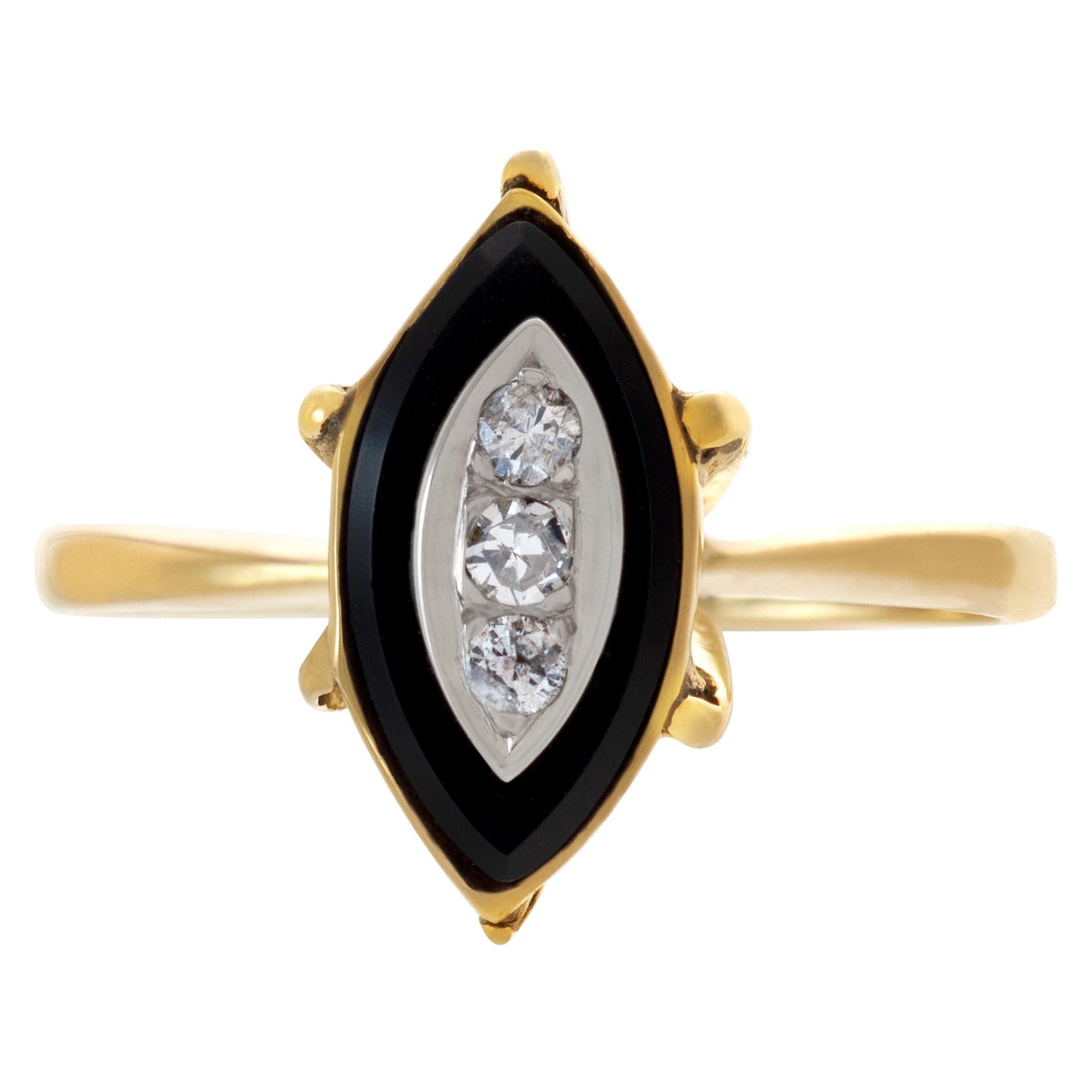 Vintage diamond and onyx ring in 14k yellow gold. Ring size: 7.5.

This Diamond ring is currently size 7.5 and some items can be sized up or down, please ask! It weighs 2.3 pennyweights and is 14k.
