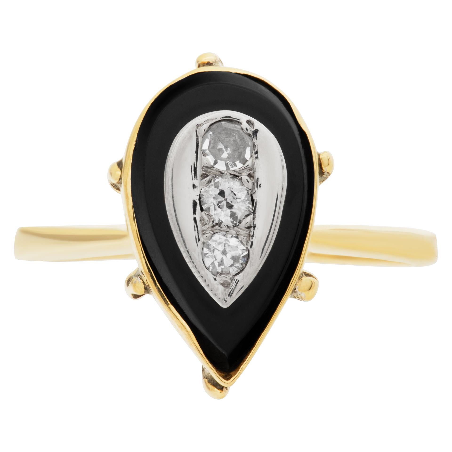 Vintage tear drop shaped diamond and onyx ring in 14k yellow gold with approximately 3 round diamond totaling approx 0.10 carat.Size 7.25

This Diamond ring is currently size 0 and some items can be sized up or down, please ask! It weighs 2.4
