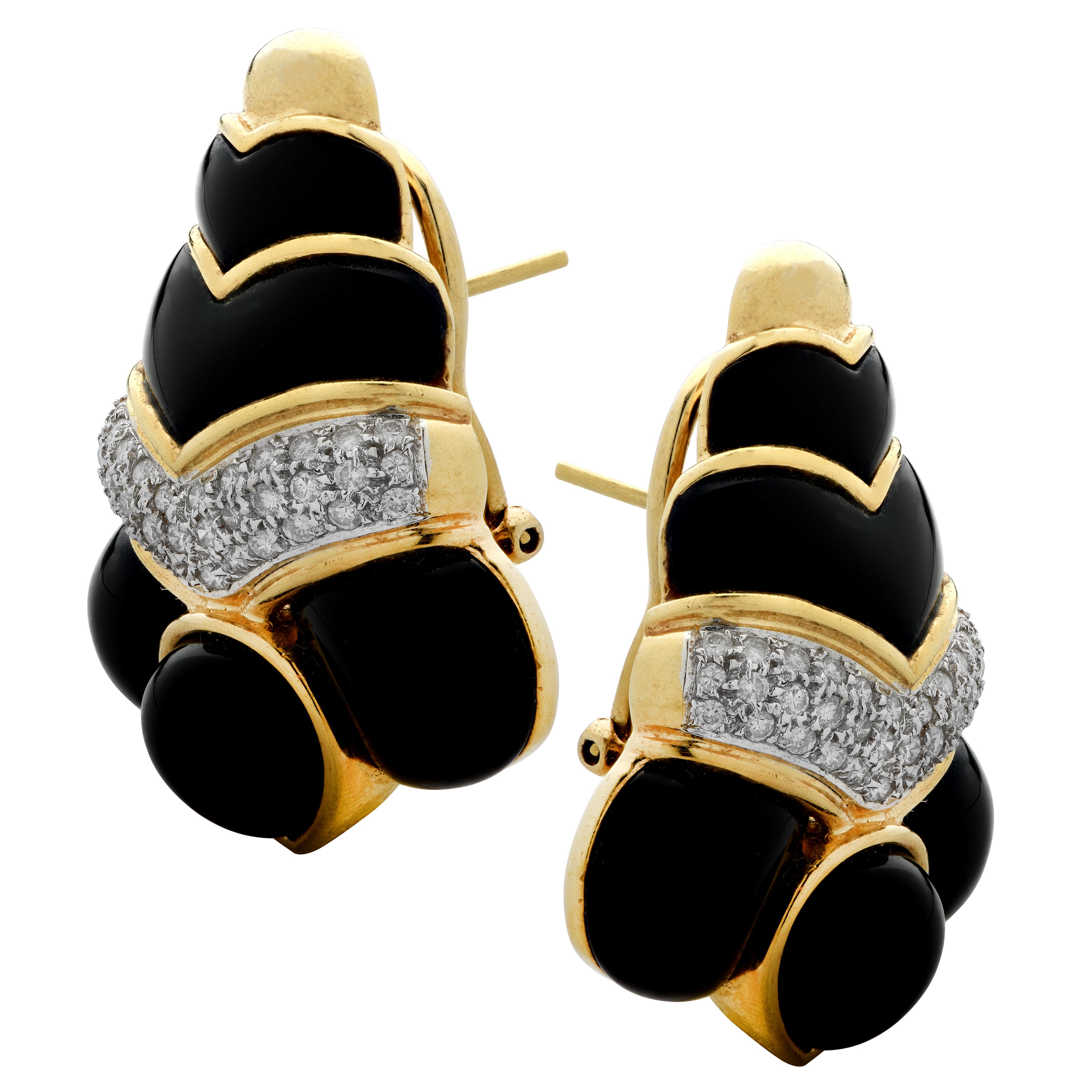 Stunning earrings crafted in 18 karat yellow gold, adorned with 74 round brilliant cut diamonds weighing approximately 1 carats total, G color, VS-SI clarity, pave set, and onyx cabochons, set in a triangular design. These earrings measure 1.38