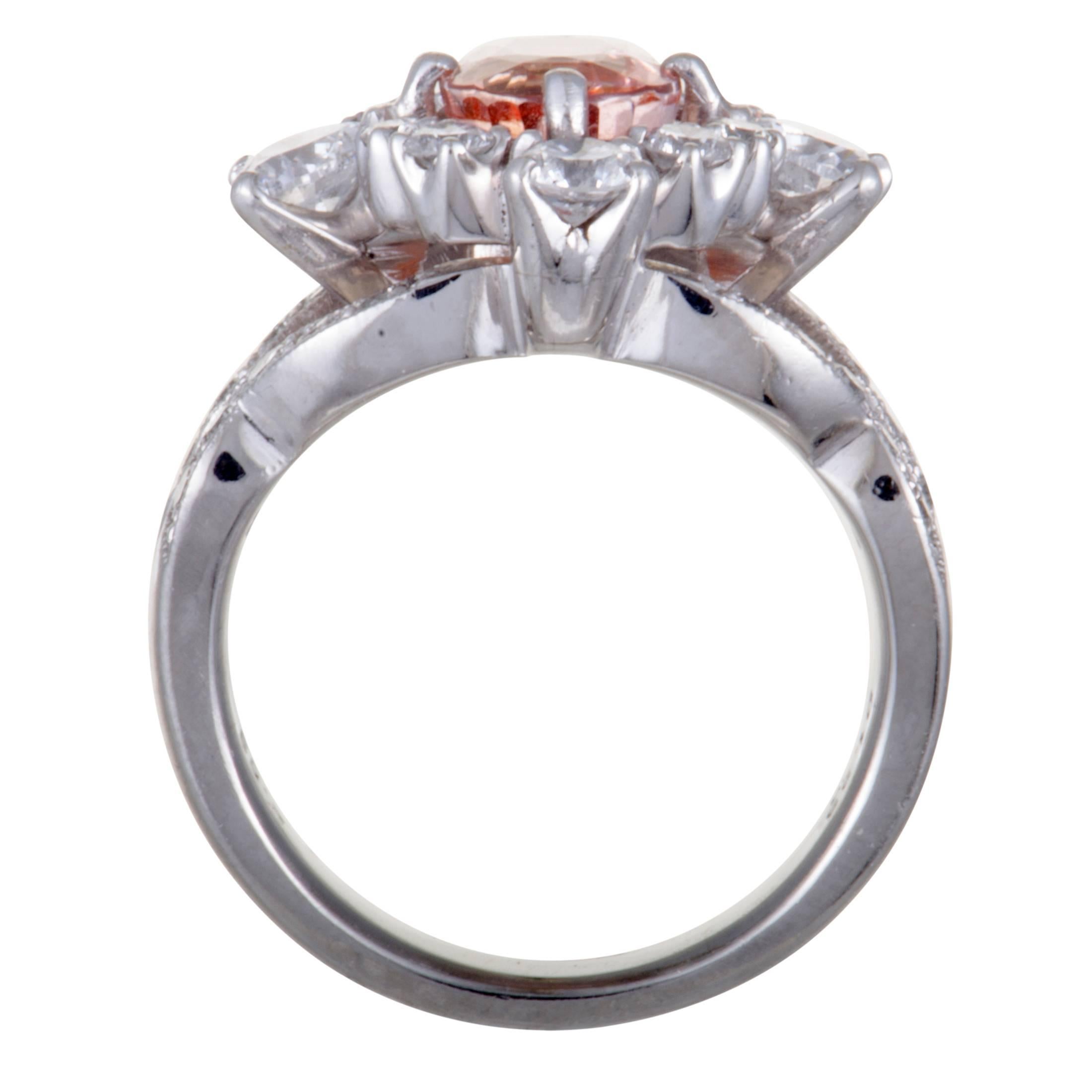 The expertly cut, eye-catching orange sapphire takes the central place in this extravagant ring that is beautifully made of luxurious platinum. The ring is also set with 1.33 carats of diamond stones, while the sapphire weighs 2.53 carats.
Ring