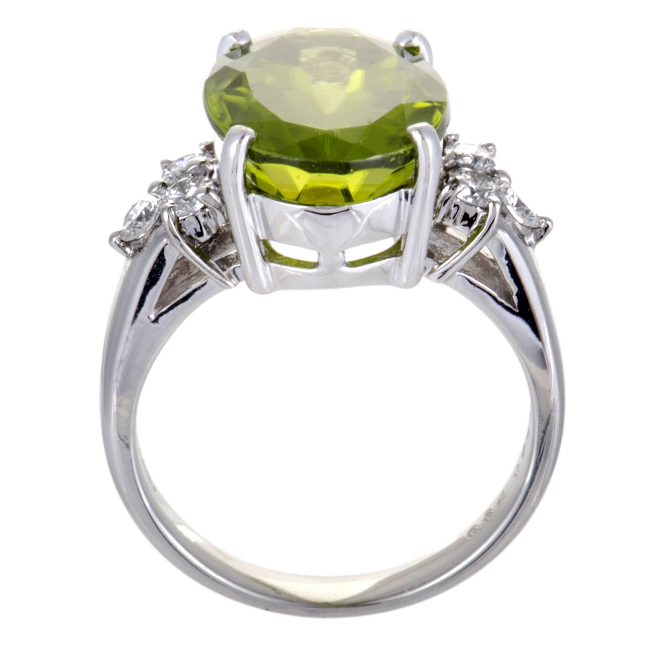 This exquisite platinum ring features an extravagantly feminine appeal and a radiantly alluring style. The gorgeous ring includes 0.35ct of dazzling diamonds and a of sparkling peridot of 6.84ct that elevates the charming appeal of the glamorous