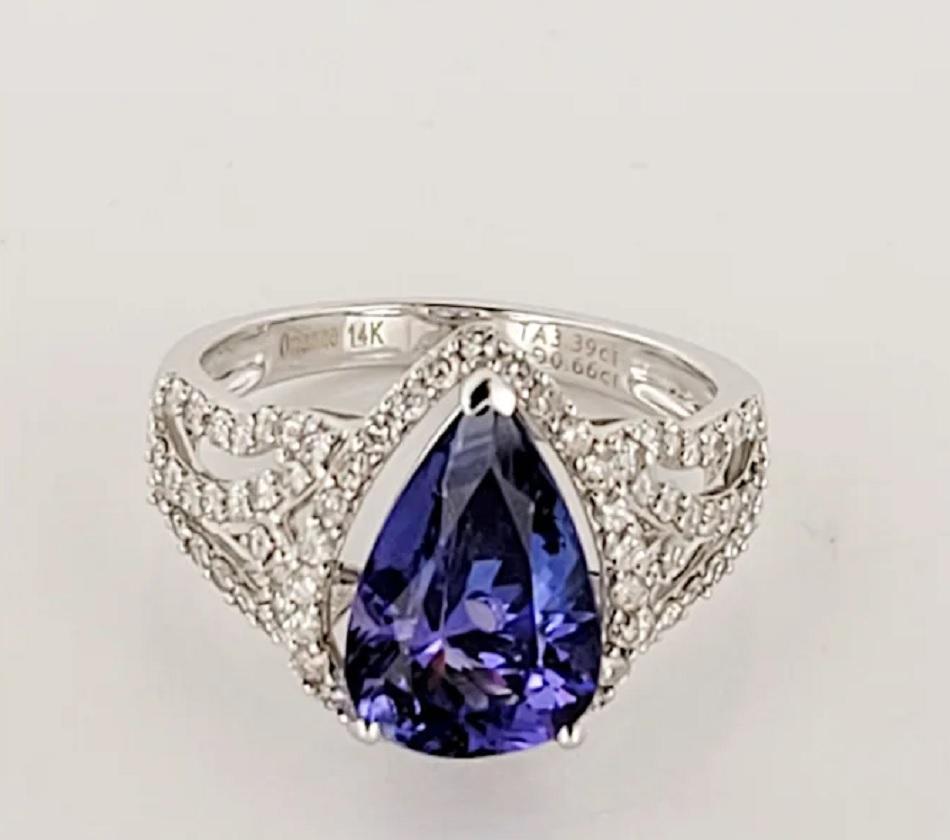 Tanzanite and Diamond Ring Set in 14K White Gold. Tanzanite: 3.5 carat. Measurements: 12.8 x 8.00mm.Diamond 0.65 carats in total of G color and SI clarity. Size 7. Weight 4.6 grams. Retail Price is $5900.