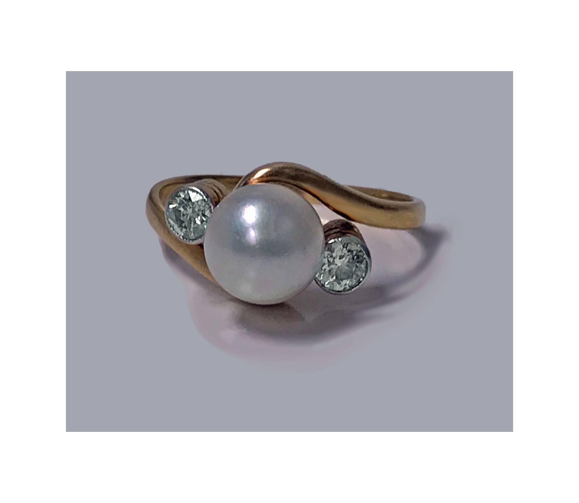 Early 20th century Diamond and Pearl 18K Ring, C.1920. The ring of twist design set with an 8.00mm fine round silver white pearl, slight rose overtone, medium nacre, good lustre, very slightly blemished, flanked on either side with a bezel