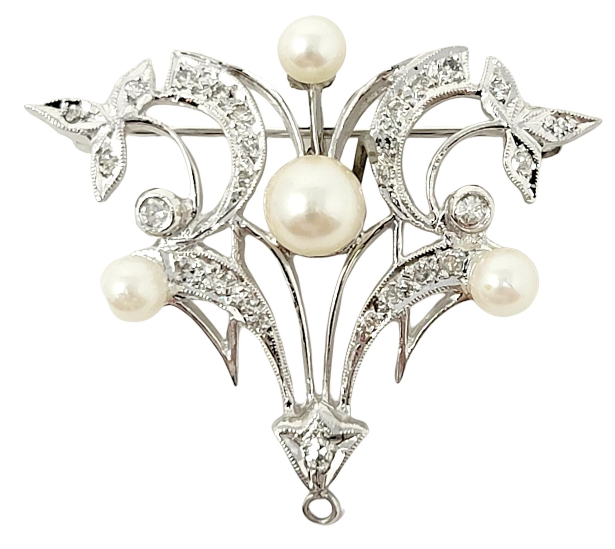 Lovely vintage diamond and pearl brooch / enhancer with delicate milgrain detailing. 

Metal: 14 White Gold
Pearls: 4
Natural Diamonds: .40 ctw
Diamond cut: Round brilliant
Diamond color: G-H-I
Diamond clarity: VS-SI
Weight: 7.4 grams
Length: