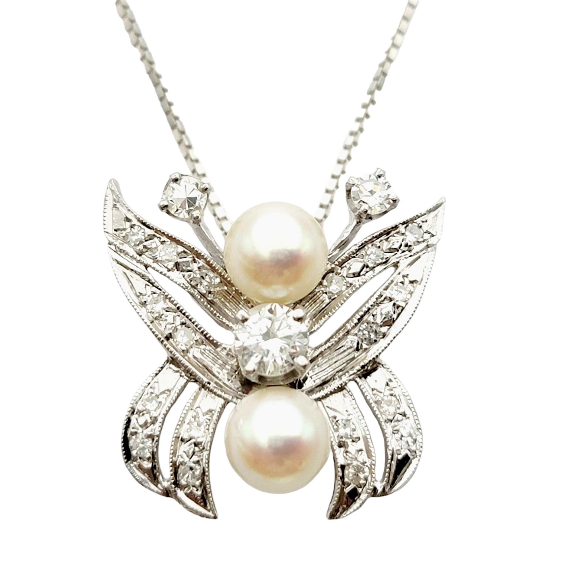 Absolutely gorgeous diamond and pearl butterfly enhancer in exquisite 14 karat white gold. This enchanting piece encapsulates the beauty of nature and the essence of femininity. 

This incredible pendant features a delicate butterfly motif, its