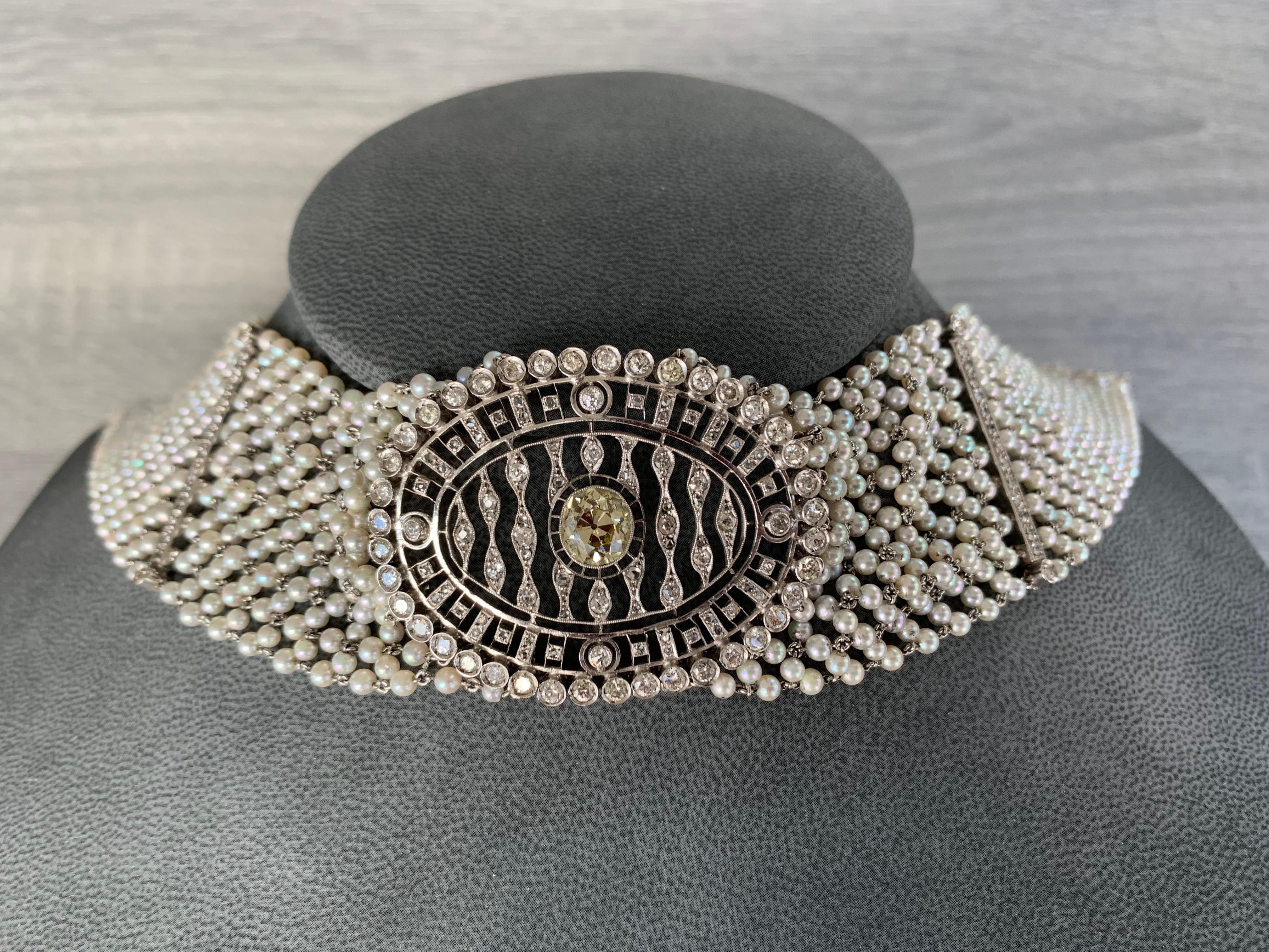 Diamond and Pearl Choker Necklace
1 center old mine cut diamond, 2.38 carats
59 round cut diamonds, 3.50 carats
55 rose cut diamonds, approximately 0.15 carats 

Mounted in white gold and platinum. 

Length approx 13.50 inches

Made Circa 1935
