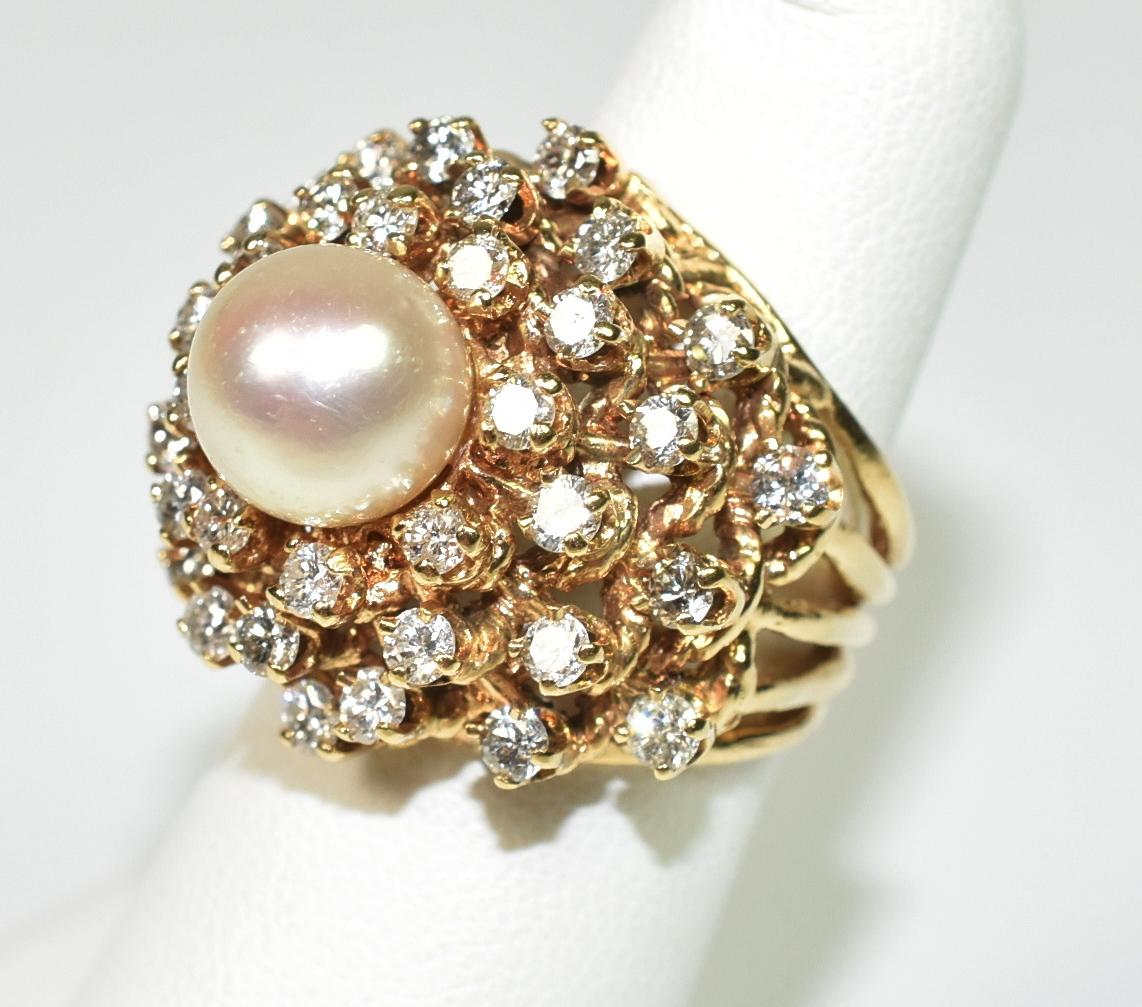 Ladies diamond and pearl cocktail ring, tested 14K gold, 1.75 cttw diamonds, 8.5mm center pearl, diamonds are SI-I with G-I color, Size 4.5 ring. 12.5 grams. Tall setting, 15mm to top of pearl.